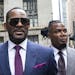 FILE - This March 13, 2019 file photo shows R. Kelly and his publicist Darryll Johnson, right, leaving The Daley Center after an appearance in court f