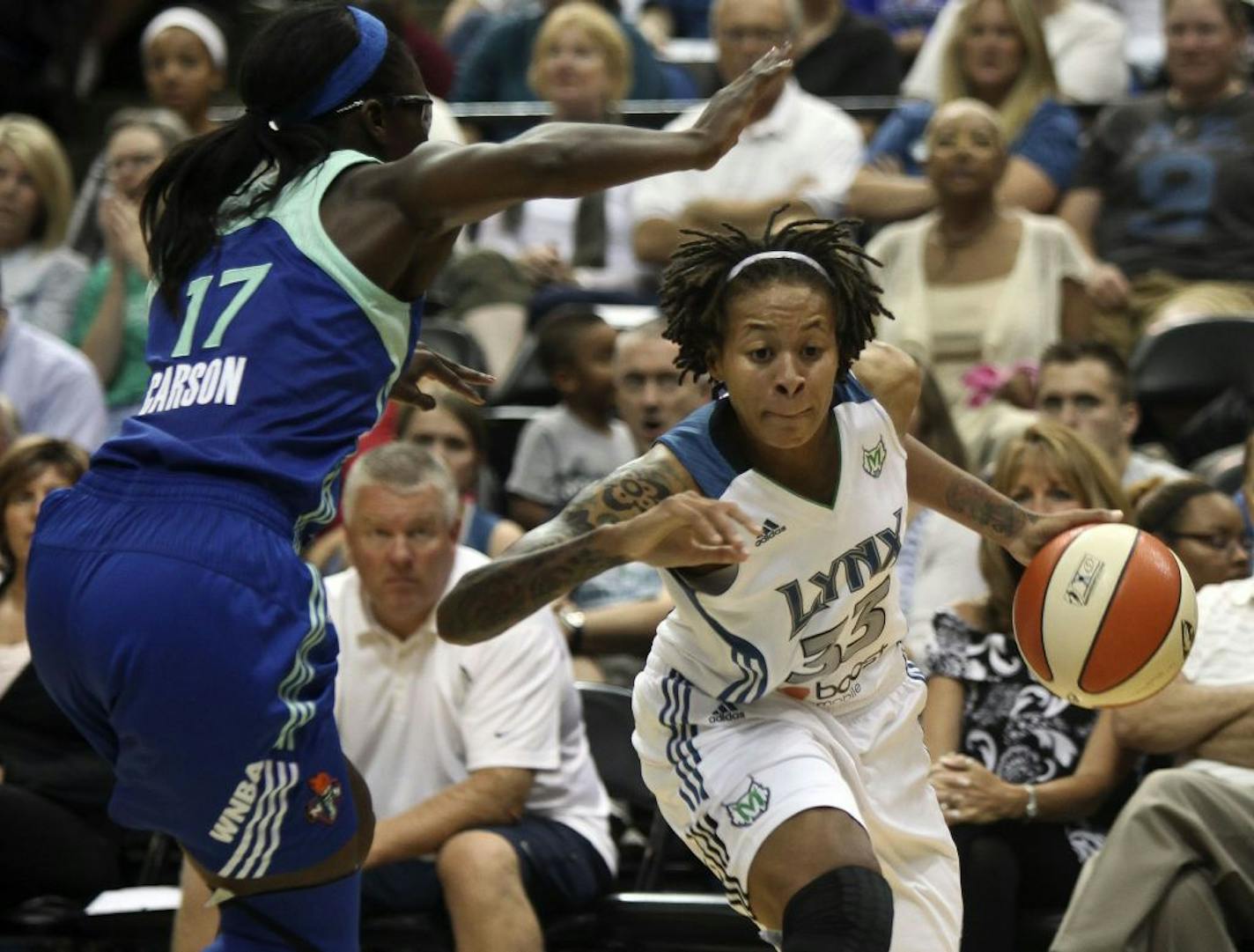 Lynx Seimone Augustus drove to the basket against Liberty'sEssence Carson in the first half at the Target Center in Minneapolis, Minn., Friday, September 2, 2011