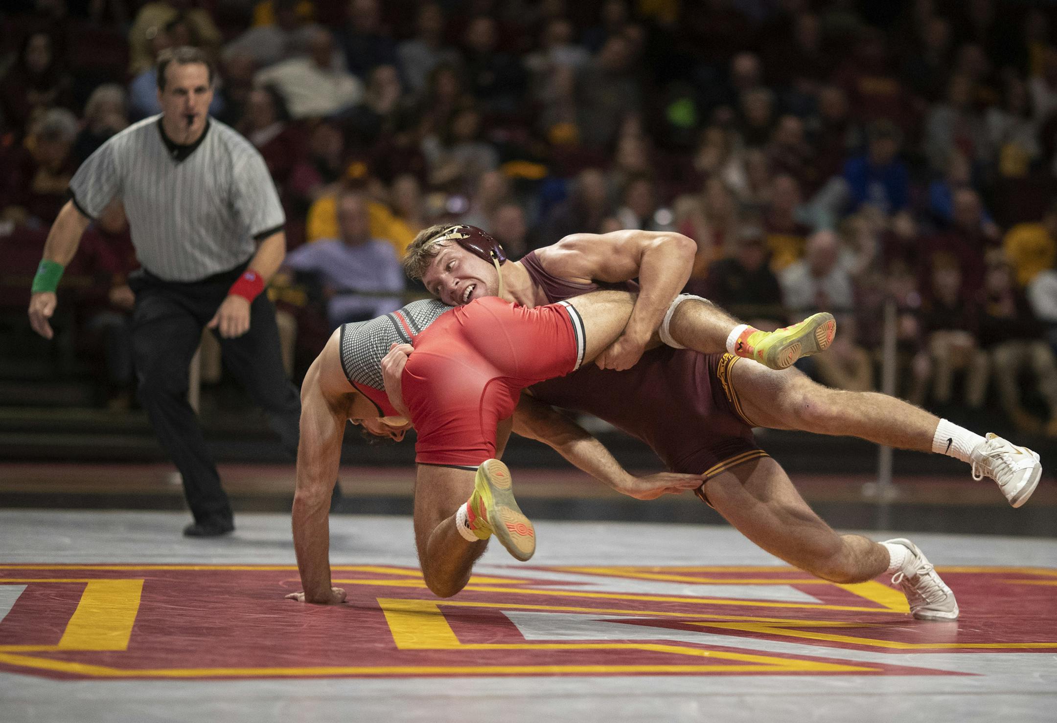 The Gophers' Devin Skatzka scored two points on a takedown over Joe Grello of Rutgers in their 174-pound match at Maturi Pavilion on Sunday. The Gophers won 22-15.