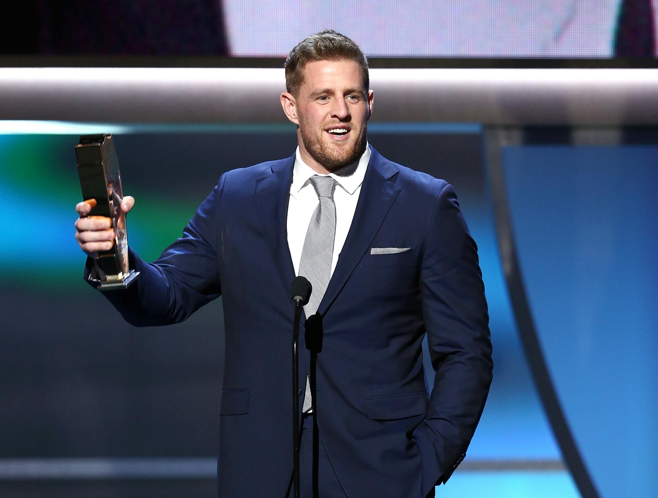 J.J. Watt of the Houston Texans accepts the AP defensive player of the year award at the 5th annual NFL Honors at the Bill Graham Civic Auditorium on Saturday, Feb. 6, 2016, in San Francisco. (Photo by John Salangsang/Invision for NFL/AP Images)