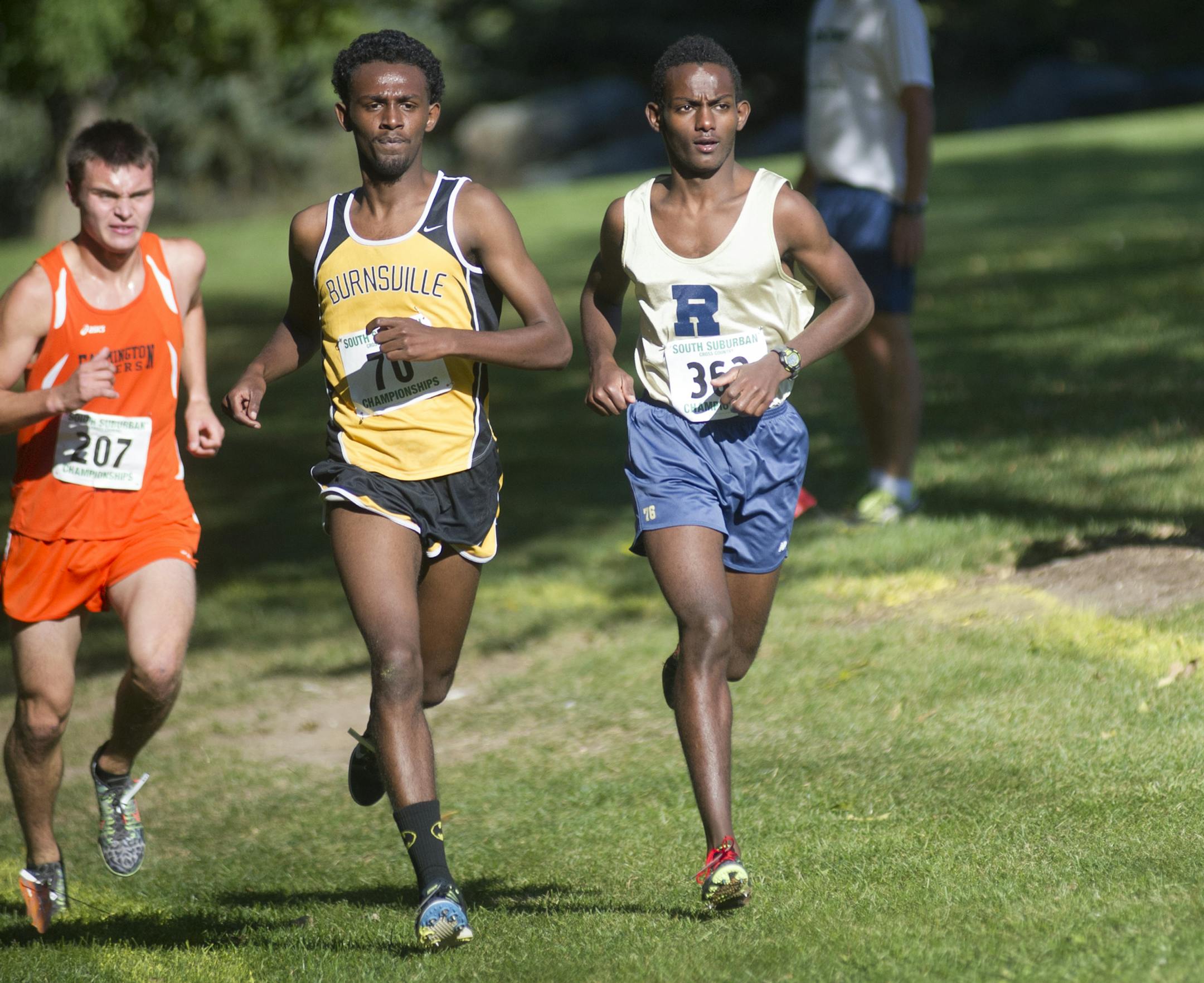 Rosemount's Alex Berhe, right, approaches the 2 mile mark during the South Suburban Conference Cross Country Meet, Friday at Eagan High School. ] (Matthew Hintz, 101514, Eagan)