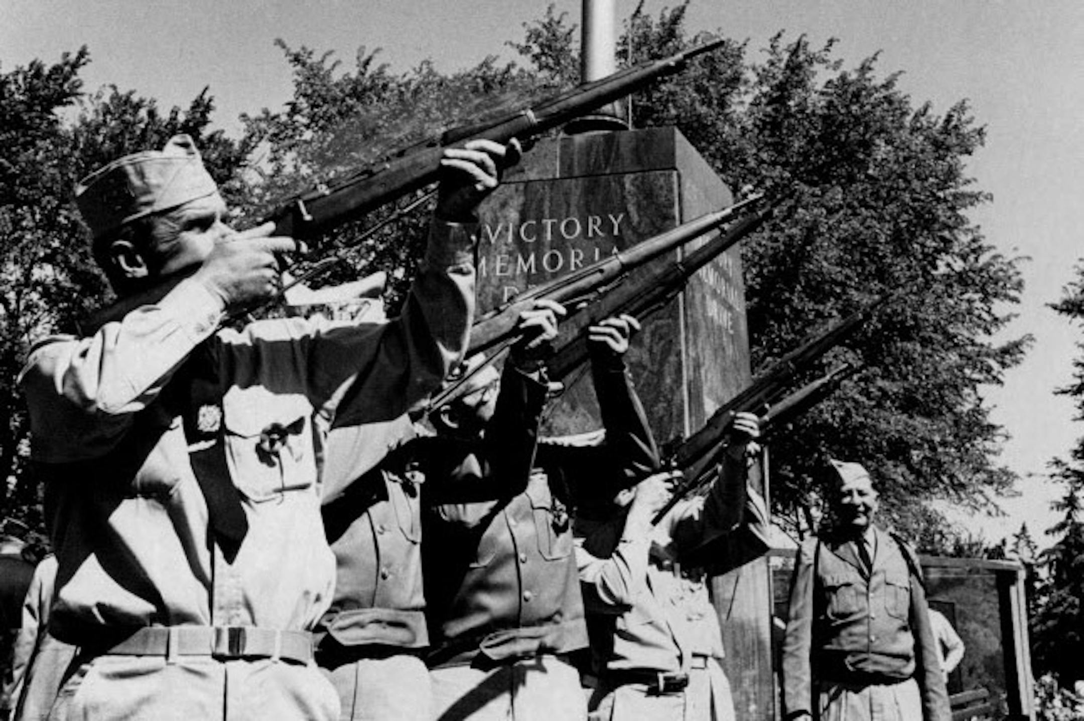 Victory Memorial Drive in Minneapolis was designed to honor WWI veterans. In this 1966 photo, the rifle team of Clarence LaBelle Post 217, Veterans of Foreign Wars, fired a salute near the flagpole during a Memorial Day program.