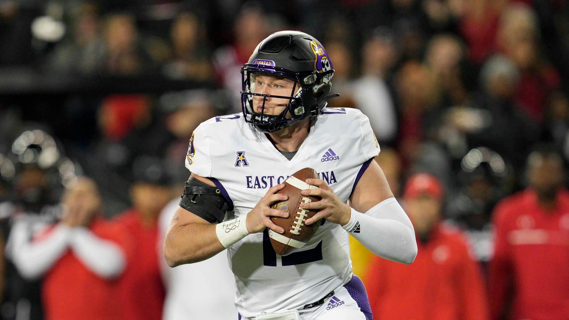 East Carolina quarterback Holton Ahlers (12) plays during an NCAA college football game against Cincinnati, Friday, Nov. 11, 2022, in Cincinnati. (AP Photo/Jeff Dean)