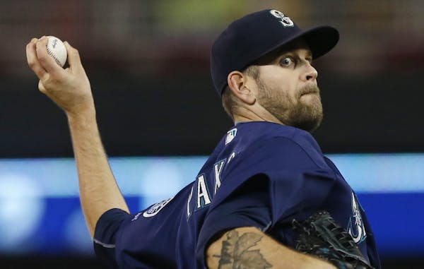 Seattle Mariners starting pitcher James Paxton throws against the Minnesota Twins during the first inning of a baseball game Friday, Sept. 23, 2016, i