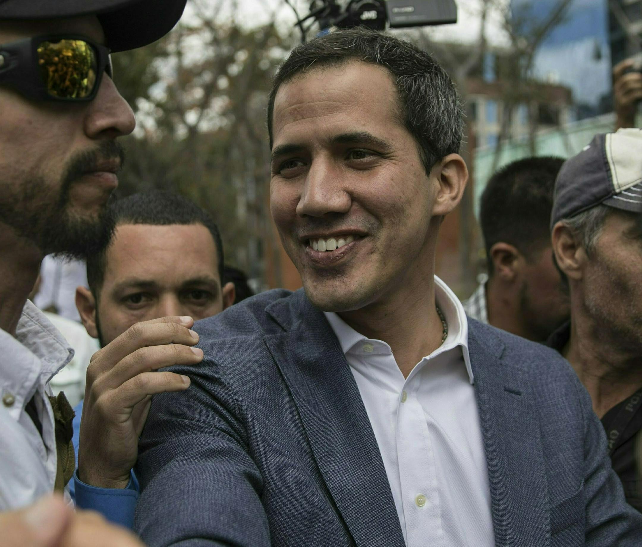 Venezuela's self-declared interim leader Juan Guaido arrives to a public plaza in Las Mercedes neighborhood of Caracas, Venezuela, Saturday, Jan. 26, 2019. Venezuela's political showdown moves to the United Nations where a Security Council meeting called by the United States will pit backers of President Nicolas Maduro against the Trump administration and supporters of Guaido. (AP Photo/Rodrigo Abd) ORG XMIT: ABD115