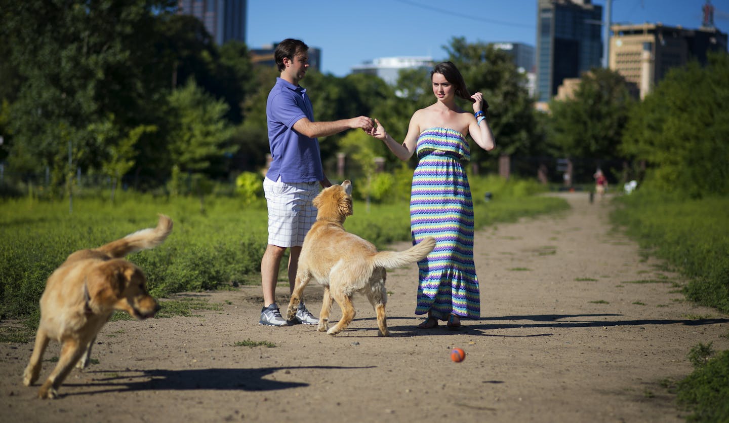 Ellie Cisek, shown at the High Bridge Dog Park in St. Paul with brother Zach and her family pets, can walk and talk but has gaps in planning and reasoning skills.