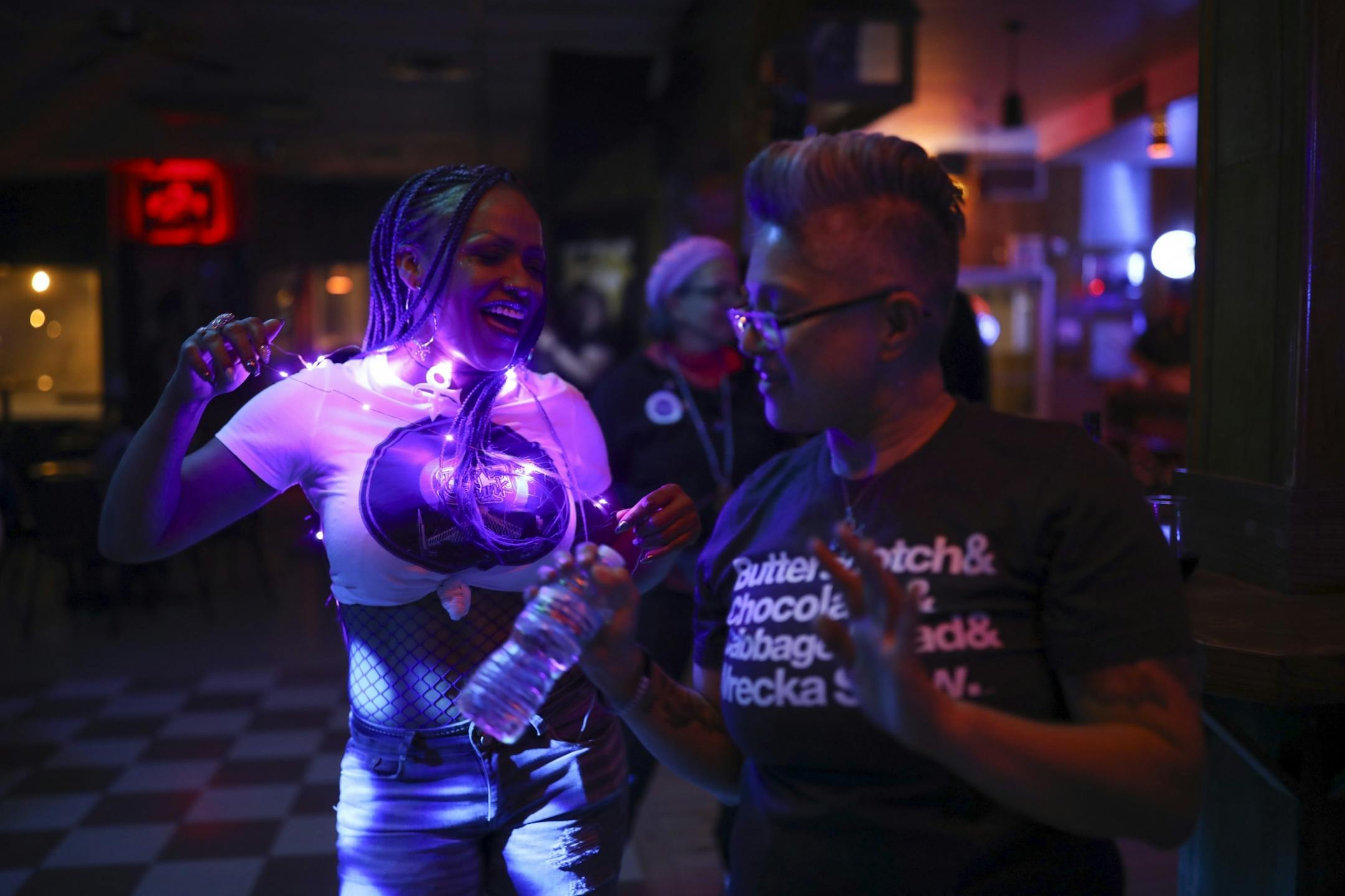 Angela Lesaca of Los Angeles, right, danced at the "Free Urself Dance Party" Wednesday night at Lee's Liquor Lounge.