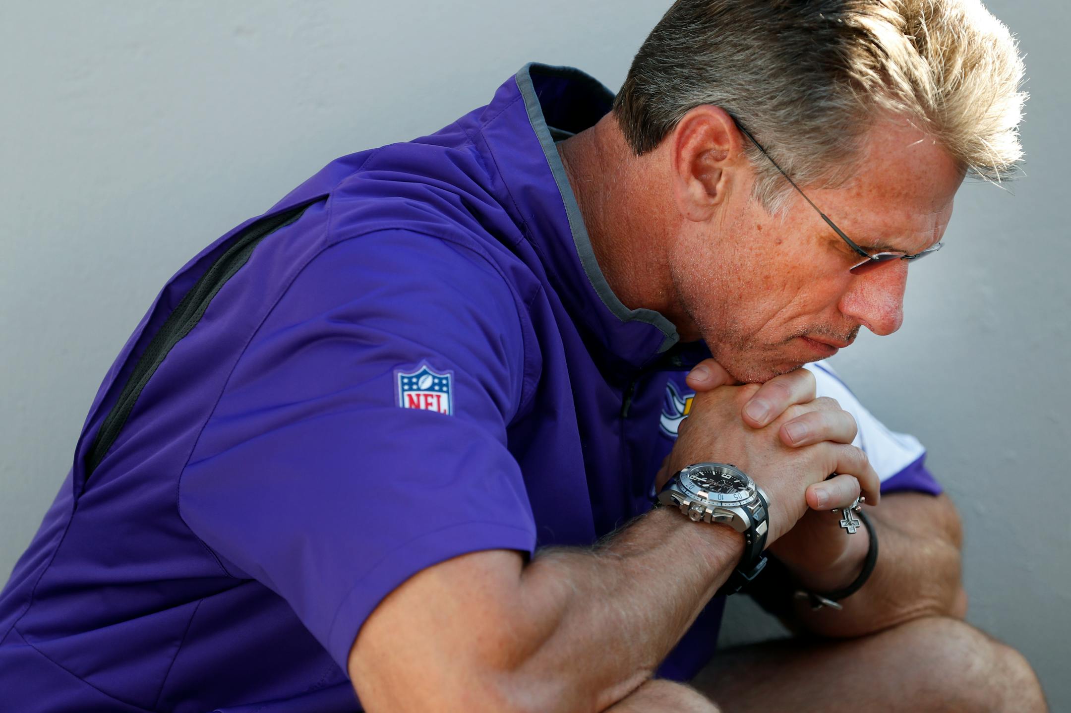 Minnesota Vikings general manager Rick Spielman listens to head coach Mike Zimmer speak during a news conference about the injury to quarterback Teddy Bridgewater.