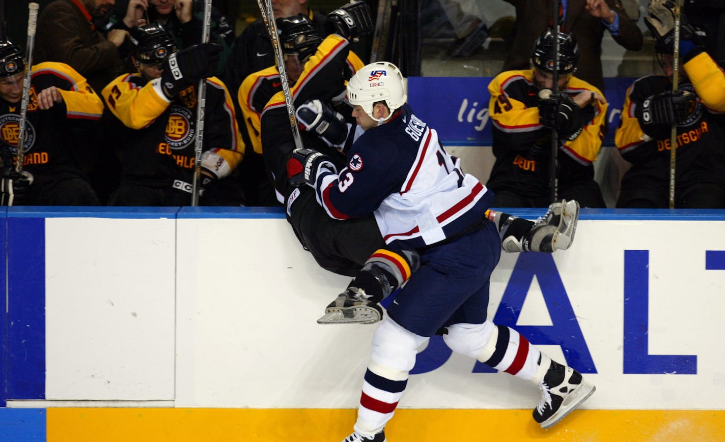 West Valley City, UT
February 20, 2002-- Salt Lake City Winter Olympics Men&#xed;s Hockey USA vs. Germany at the E Center in West Valley City, UT on Wednesday night. USA&#xed;s Bill Guerin, #13, checks Germany&#xed;s Andreas Renz, #31 in the 3rd period. The US beat Germany by a final score of 5-0.