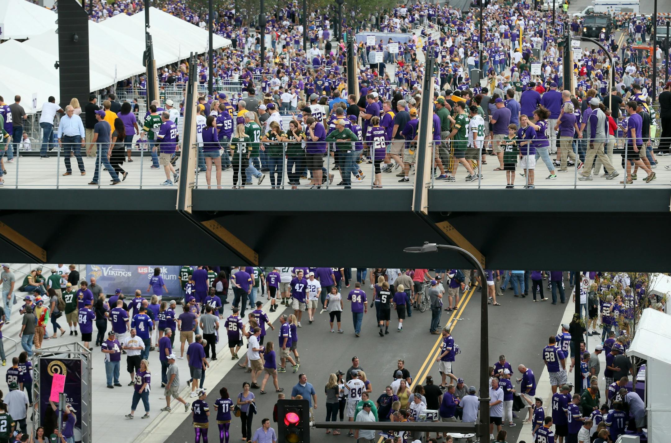 The Minnesota Vikings open the new US Bank Stadium for their first home regular season game against the Green Bay Packers. Here, Vikings fans surround the stadium as the doors opened Sunday afternoon.