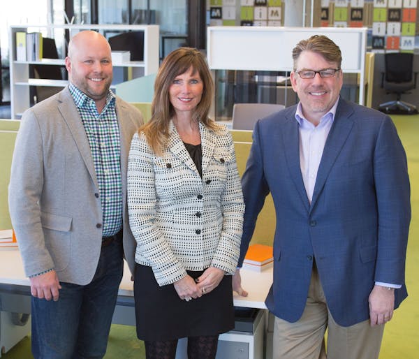 Aaron Eggert, president; Kathy Blake, principal; CEO Joel Peterson of iSpace Furniture. Photo submitted by iSpace