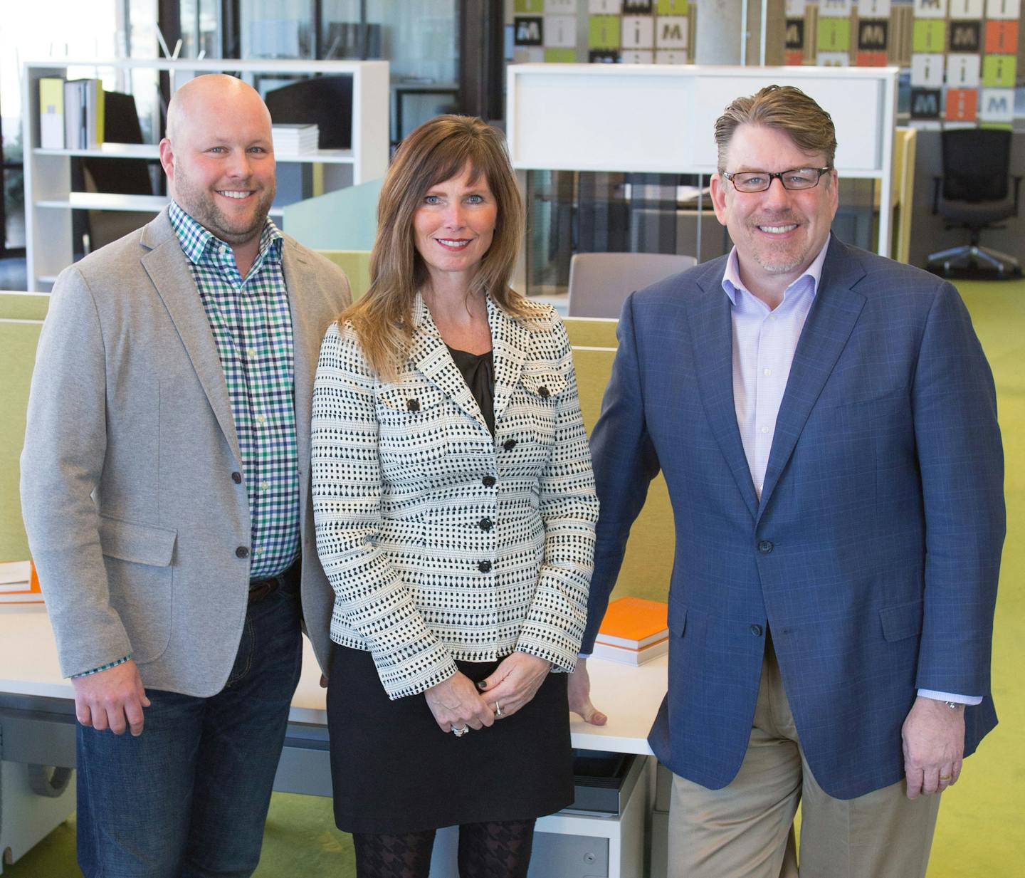 Aaron Eggert, president; Kathy Blake, principal; CEO Joel Peterson of iSpace Furniture. Photo submitted by iSpace