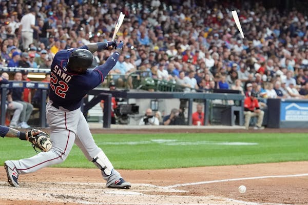 Minnesota Twins' Miguel Sano breaks his bat as he fouls off a pitch during the fourth inning of a baseball game against the Milwaukee Brewers Tuesday,