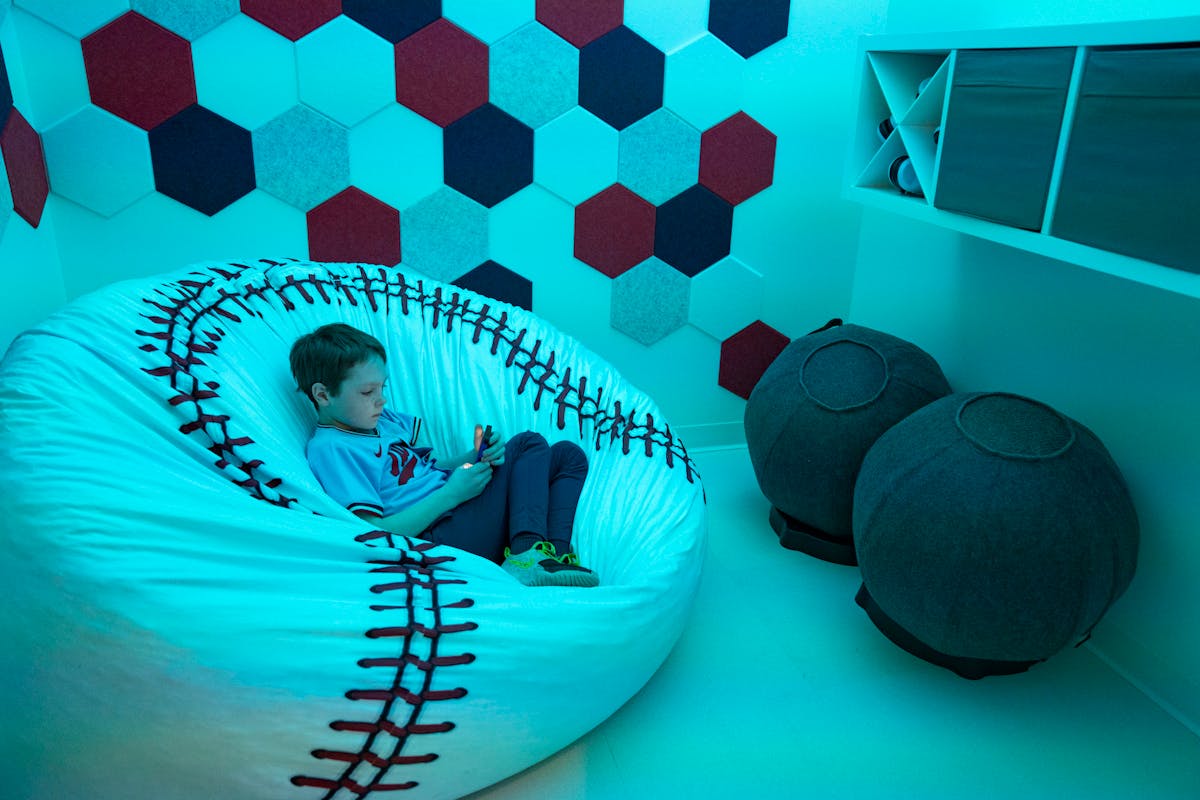 Grady Johnson, 8, tests out one of the rooms in the United Healthcare Sensory Suite on Tuesday, April 5, 2022, at Target Field in Minneapolis, Minn.