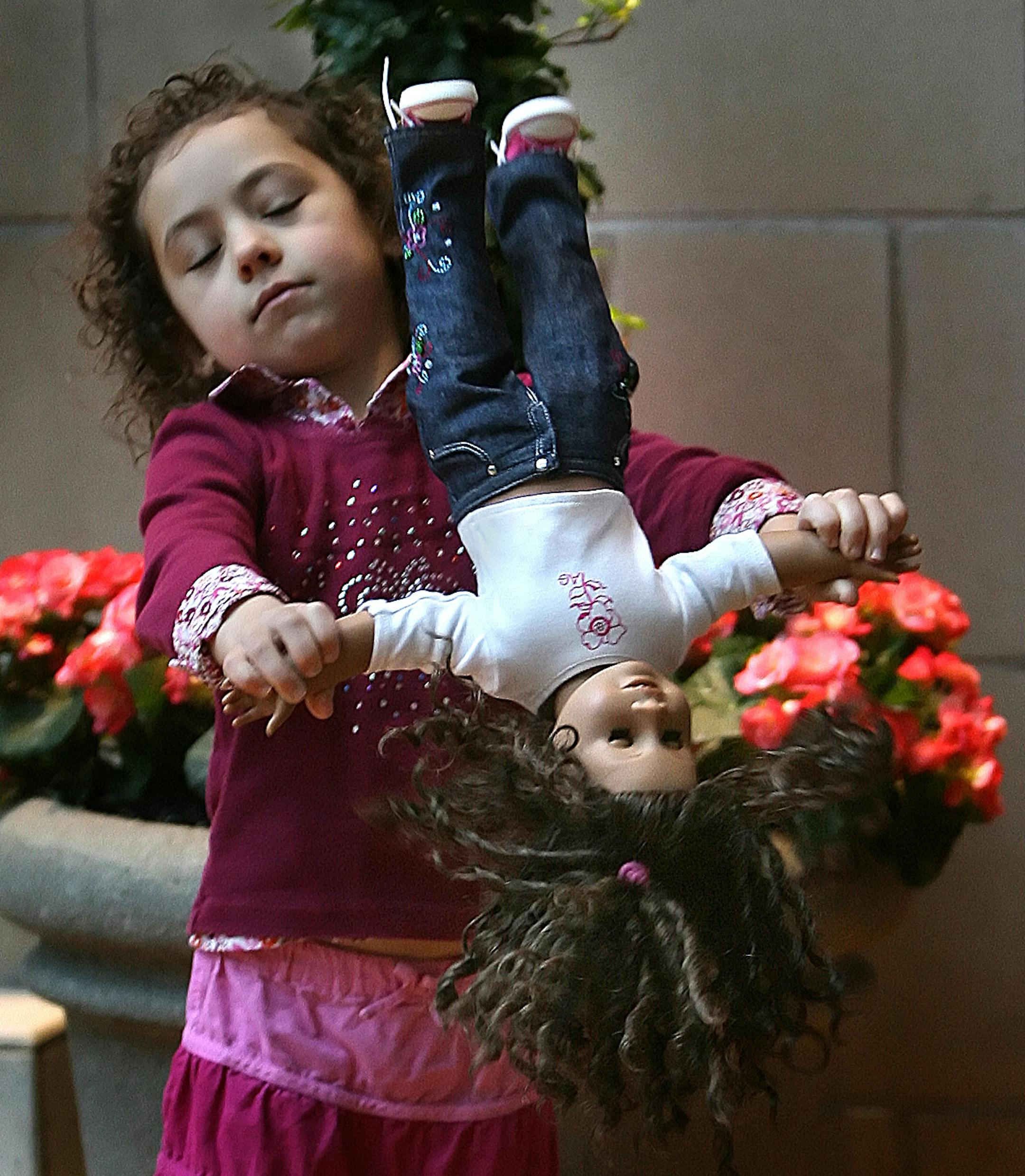 Kori VonEschen, 4, played with her American Girl doll while waiting for the new American Girl Store to open at the Mall of America.