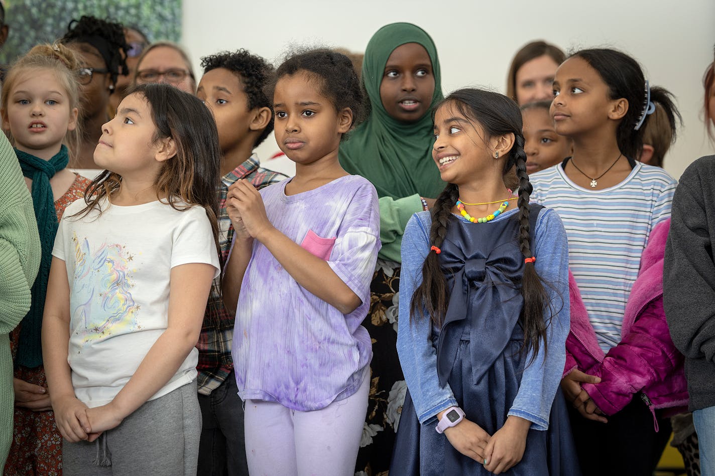 Kids watch as elected officials speak before Minnesota Governor Tim Walz signs into law a bill that guarantees free school meals, (breakfast and lunch) for every student in Minnesota's public and charter schools during a press conference at at Webster Elementary in Minneapolis, Minn., on Friday, March 17, 2023. ] Elizabeth Flores • liz.flores@startribune.com