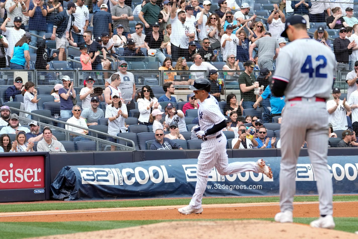 New York Yankees' Anthony Rizzo runs the bases after hitting a solo home run off of Minnesota Twins pitcher Tyler Mahle, right, in the third inning of a baseball game, Saturday, April 15, 2023, in New York. (AP Photo/Mary Altaffer)