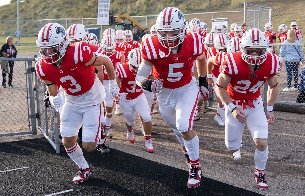 Lakeville North’s players surged onto the field ahead of their game this season against Lakeville South. On Friday, the opponent will be Coon Rapids