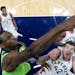 Minnesota Timberwolves forward Andrew Wiggins (22) dunked the ball over Toronto Raptors center Jakob Poeltl (42) in the first half Saturday.