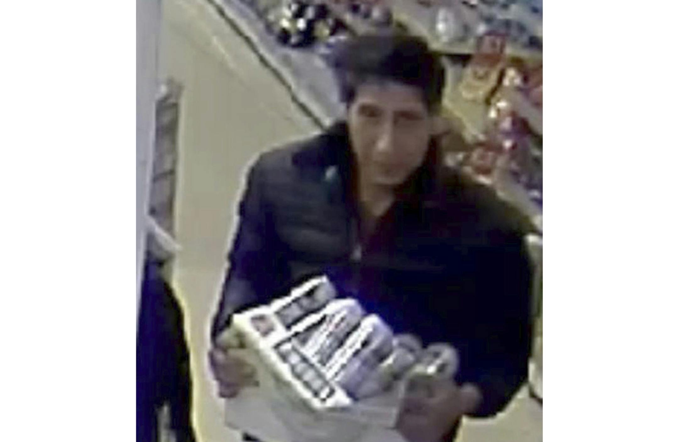 In this undated photo released Wednesday Oct. 24, 2018, by Britain's Blackpool Police, showing an alleged thief bearing a striking resemblance to Ross Geller, the character played by actor David Schwimmer on the TV show "Friends." Blackpool police posted surveillance-camera footage asking for witnesses to identify their suspect, and thousands of social media users highlighted the suspect's likeness to Schwimmer's US sitcom character. The actor then responded with a Twitter video that shows him s