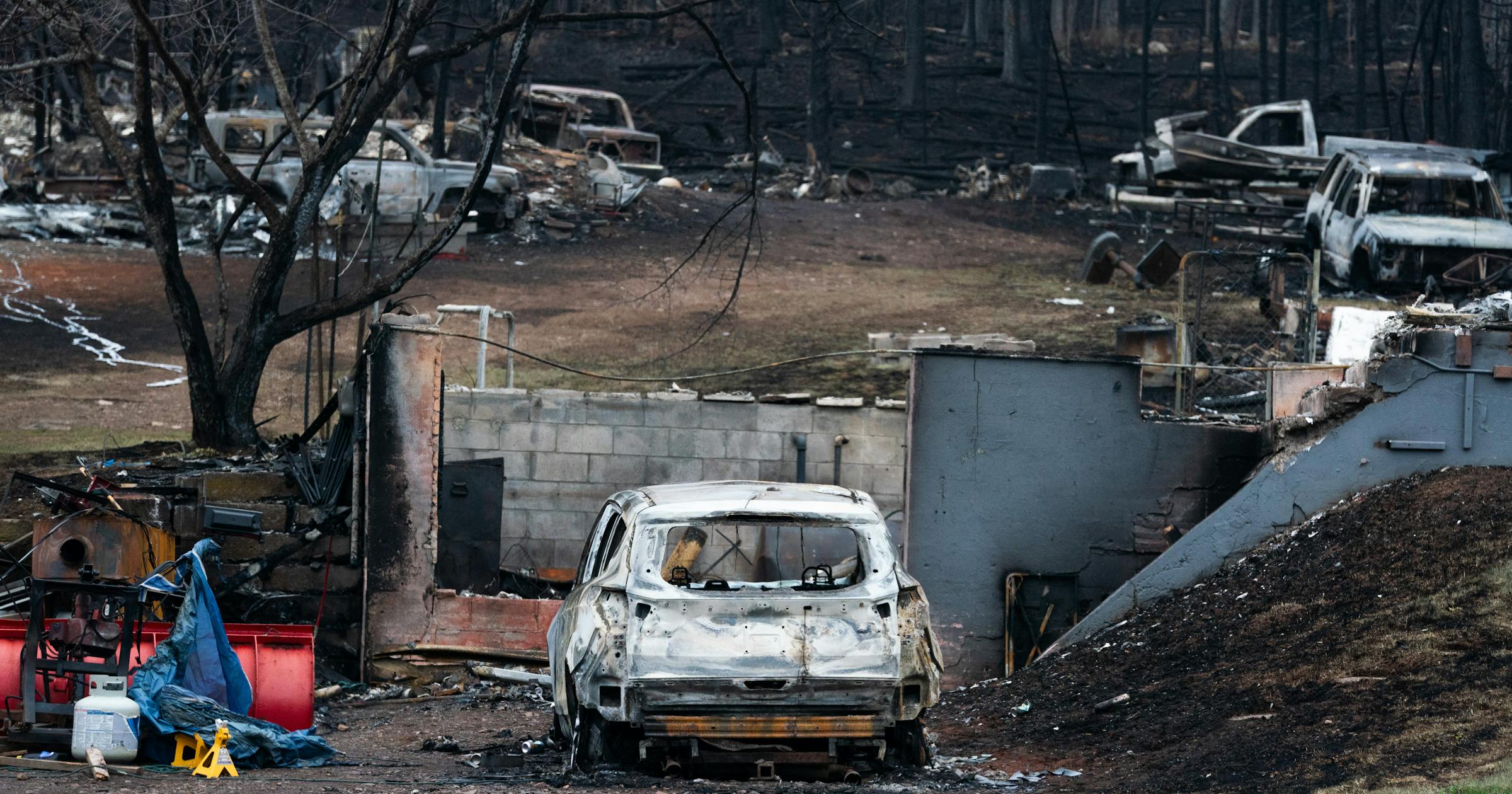 Family sifts through charred house remains after wildfire destroys parts of North Shore