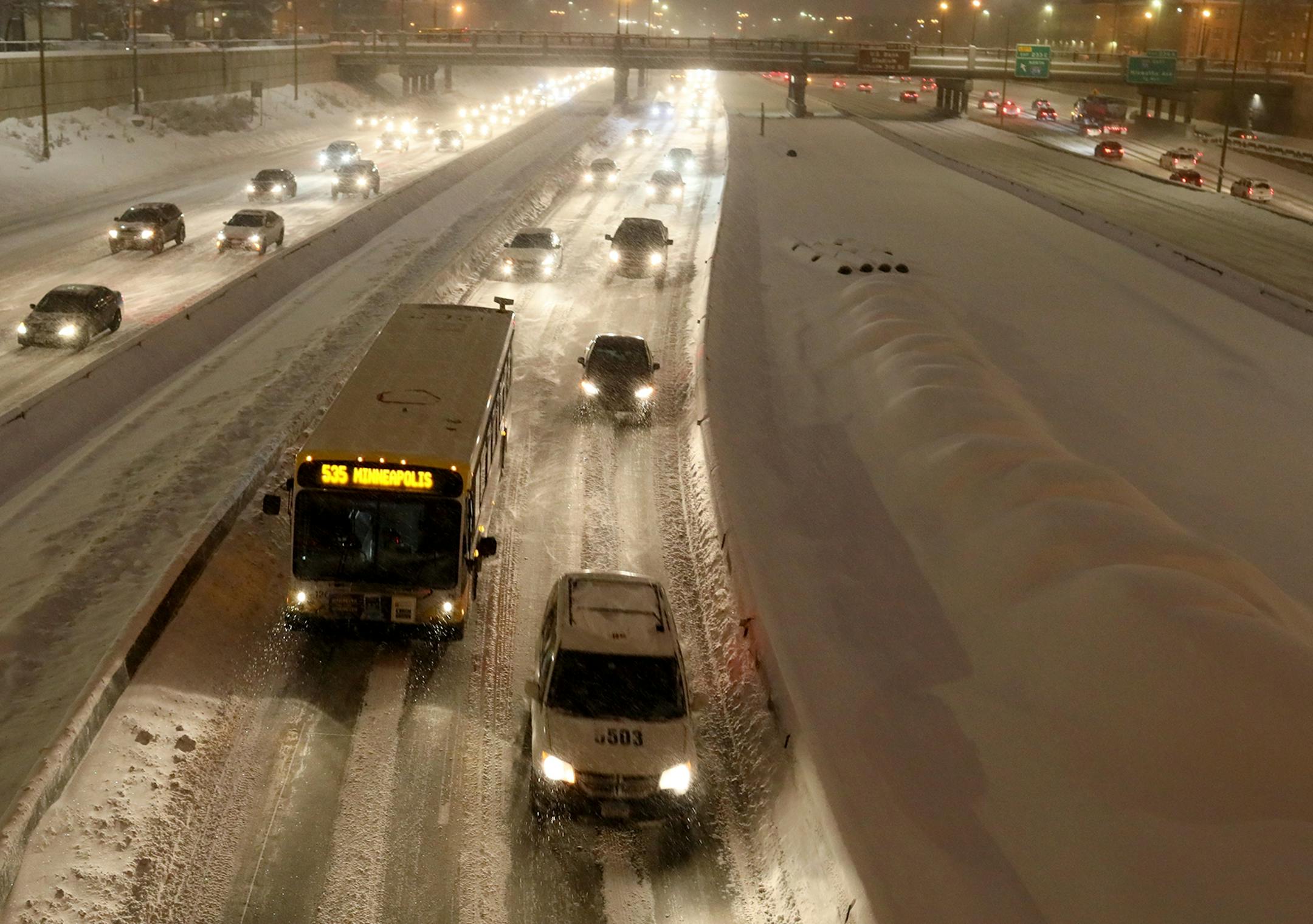 Seen from Franklin Ave., traffic creeps along I-94 west early Tuesday in Minneapolis.
