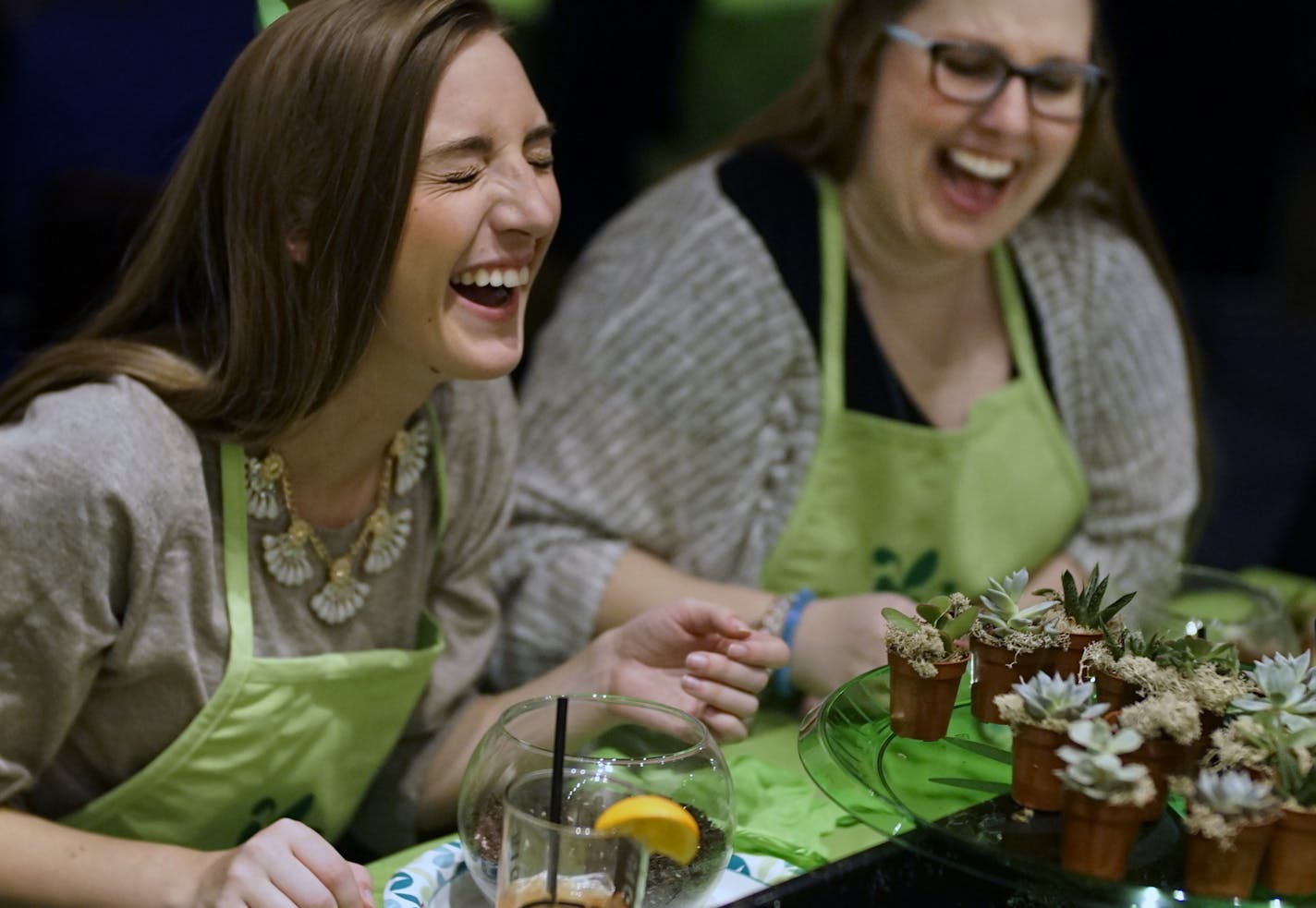 Co-workers Kari Miklya and Amy Strohacker created terrariums at a micro gardening class held at Mason's restaurant in downtown Minneapolis.