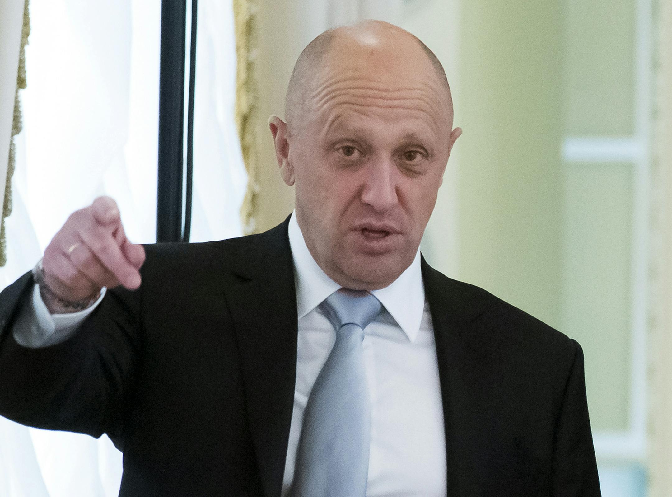 FILE - In this Tuesday, Aug. 9, 2016 file photo, businessman Yevgeny Prigozhin gestures at the Konstantin palace outside St. Petersburg, Russia.