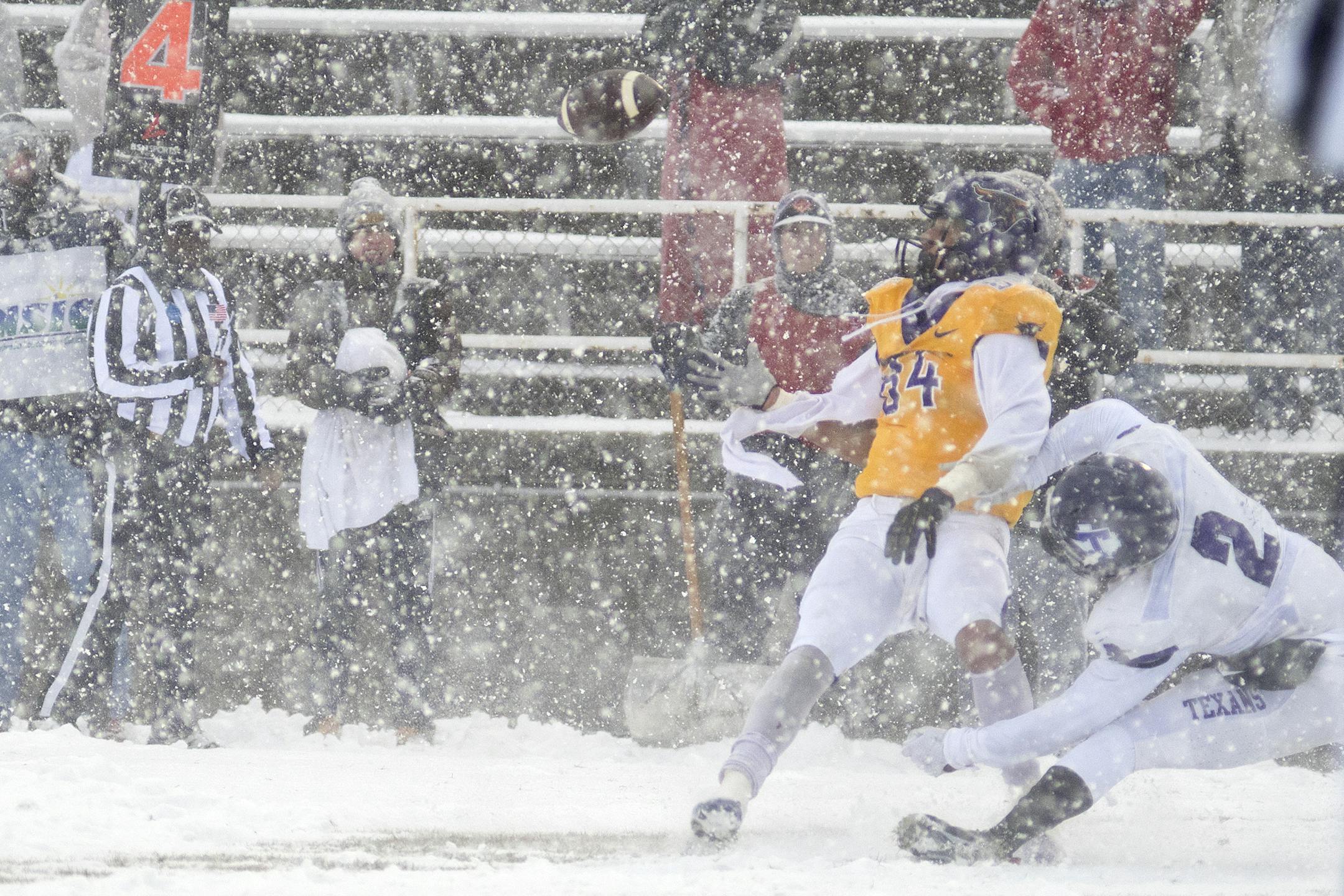 Minnesota State's Shane Zylstra makes a touchdown catch while falling down, while a Tarleton defender, Devin Hafford tried to break up the pass. Zylstra's catch capped off a 97-yard, 27-play drive for the Mavericks. Photo by Jackson Forderer