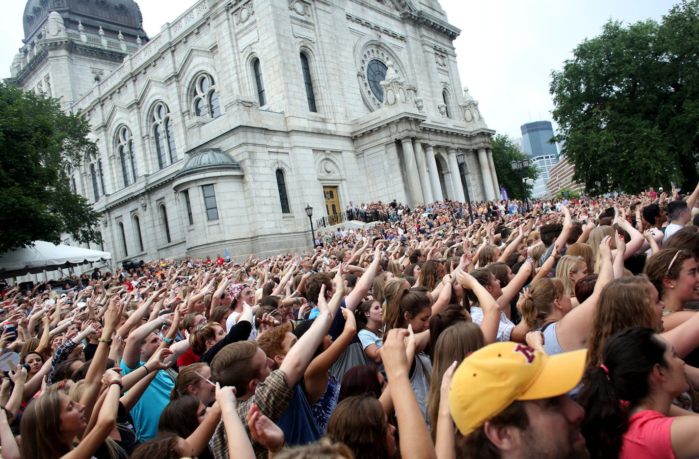 The crowd swayed its arms back and forth to the music of Eric Hutchinson ] (KYNDELL HARKNESS/STAR TRIBUNE) kyndell.harkness@startribune.com During the Basilica Block Party in Minneapolis, Min. Friday, July 11, 2014.