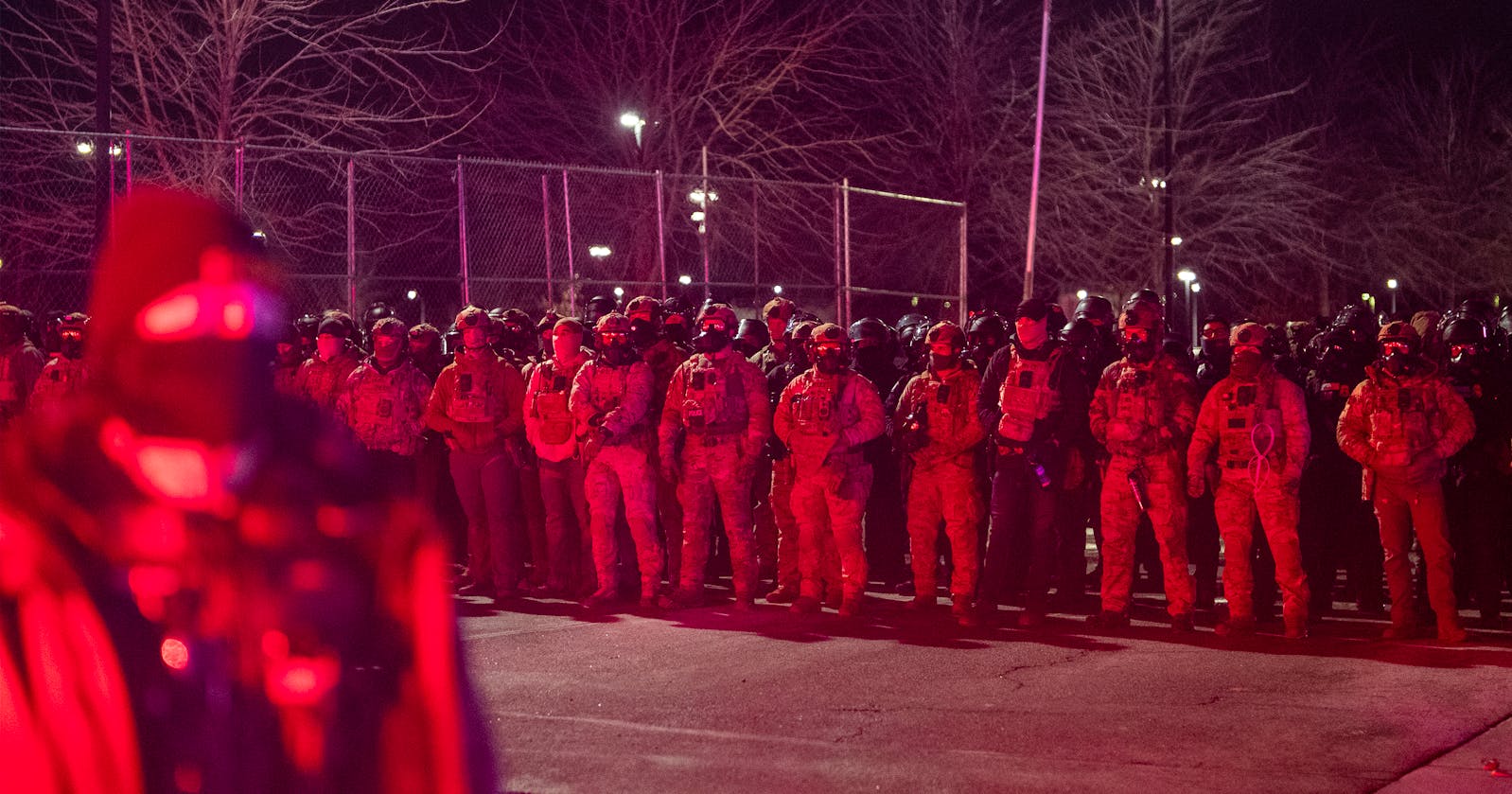 ICE makes its presence known to protesters during zero degree weather at the entrance of the Whipple Federal Building to protest the escalation of ICE presence in Minnesota in St. Paul, Minn., on Saturday, Jan. 17, 2026. 