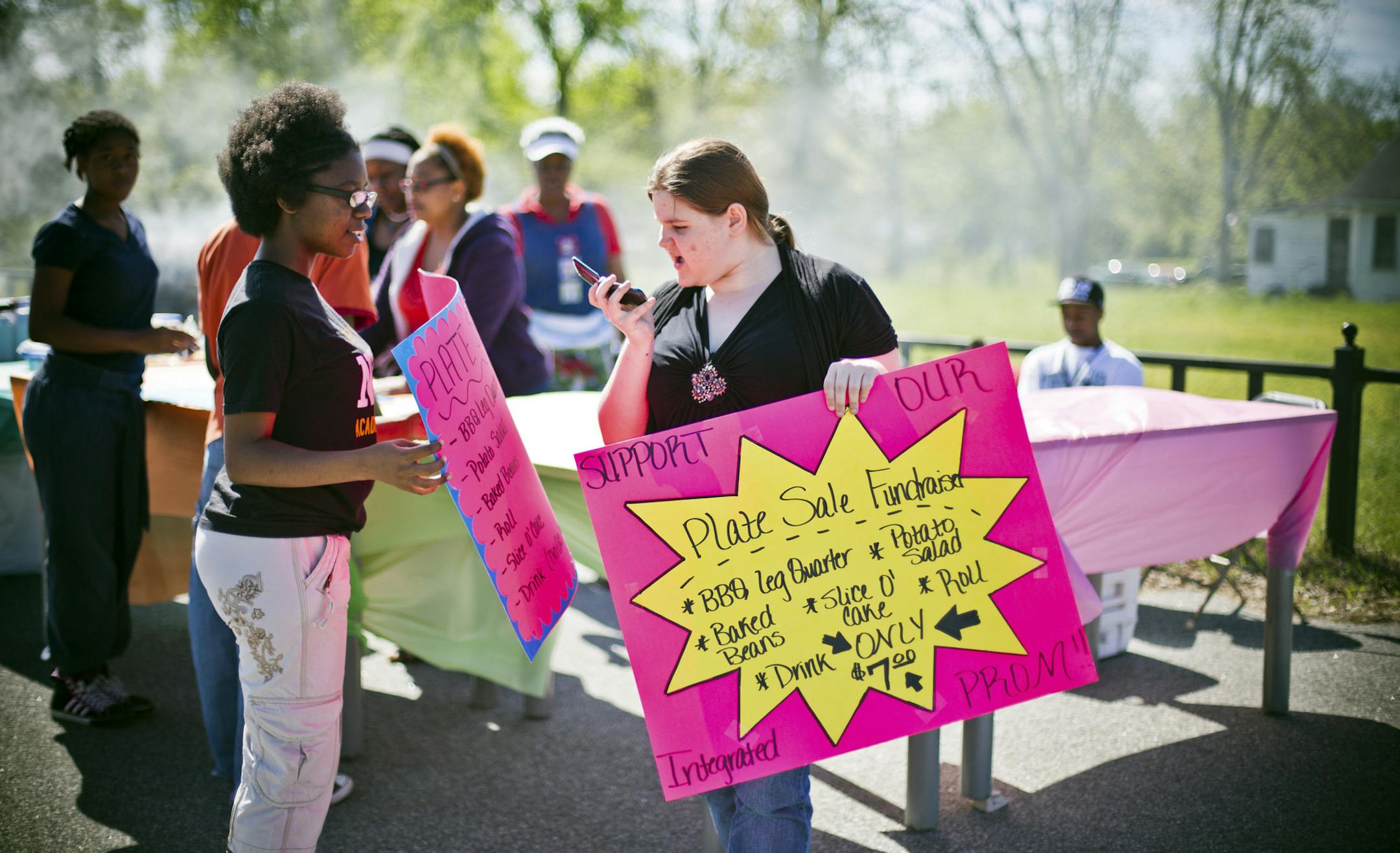 Mareshia Rucker, 17, left, and Stephanie Sinnott, 18, sell plates of food for a fundraiser to raise the money needed for Wilcox County's first integrated problem, near Abbeville, Ga., April 13, 2013. A week after a "white prom" was held in Wilcox County, Ga., the first integrated prom, organized by students, will take place. (Bryan Meltz/The New York Times)