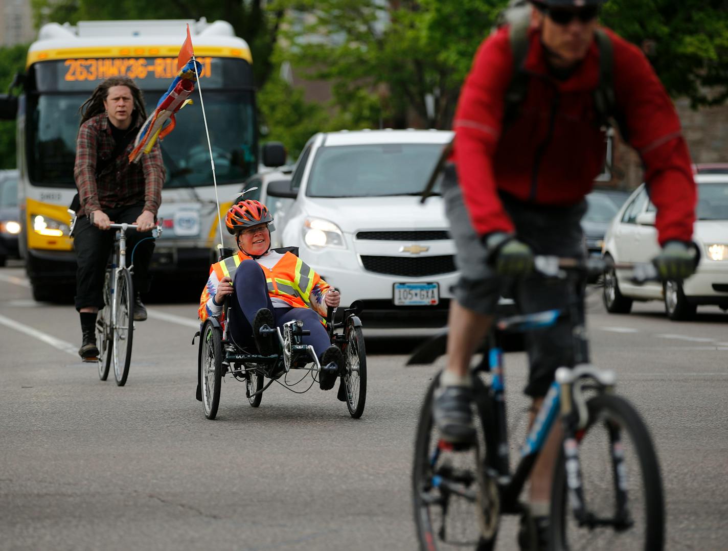 Buses, drivers, riders negotiate an evening rush hour in Minneapolis.