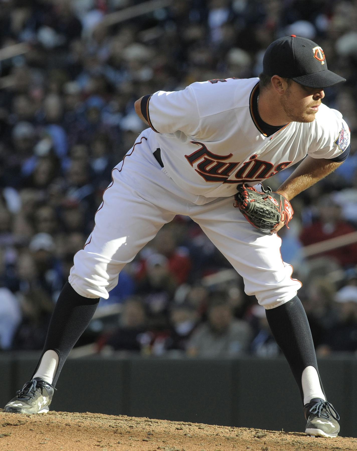 Minnesota Twins' J.R. Graham looks in for a sign from Twins' catcher Kurt Suzuki during the eighth inning of a baseball game against the Kansas City Royals, Monday, April 13, 2015 in Minneapolis. The Royals won 12-3. (AP Photo/Tom Olmscheid) ORG XMIT: MIN2015051114510034