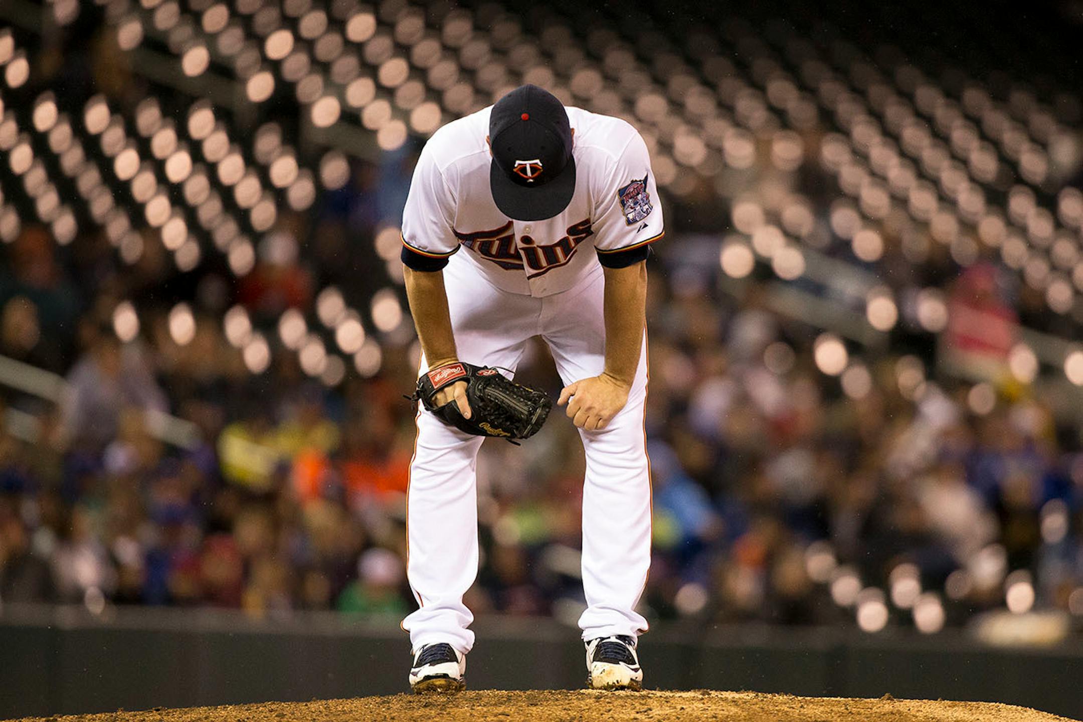 Glen Perkins was dejected as Twins manager Paul Molitor approached the mound to relieve him after Perkins allowed a two-run homer in the top of the ninth inning against the Blue Jays on Friday night.