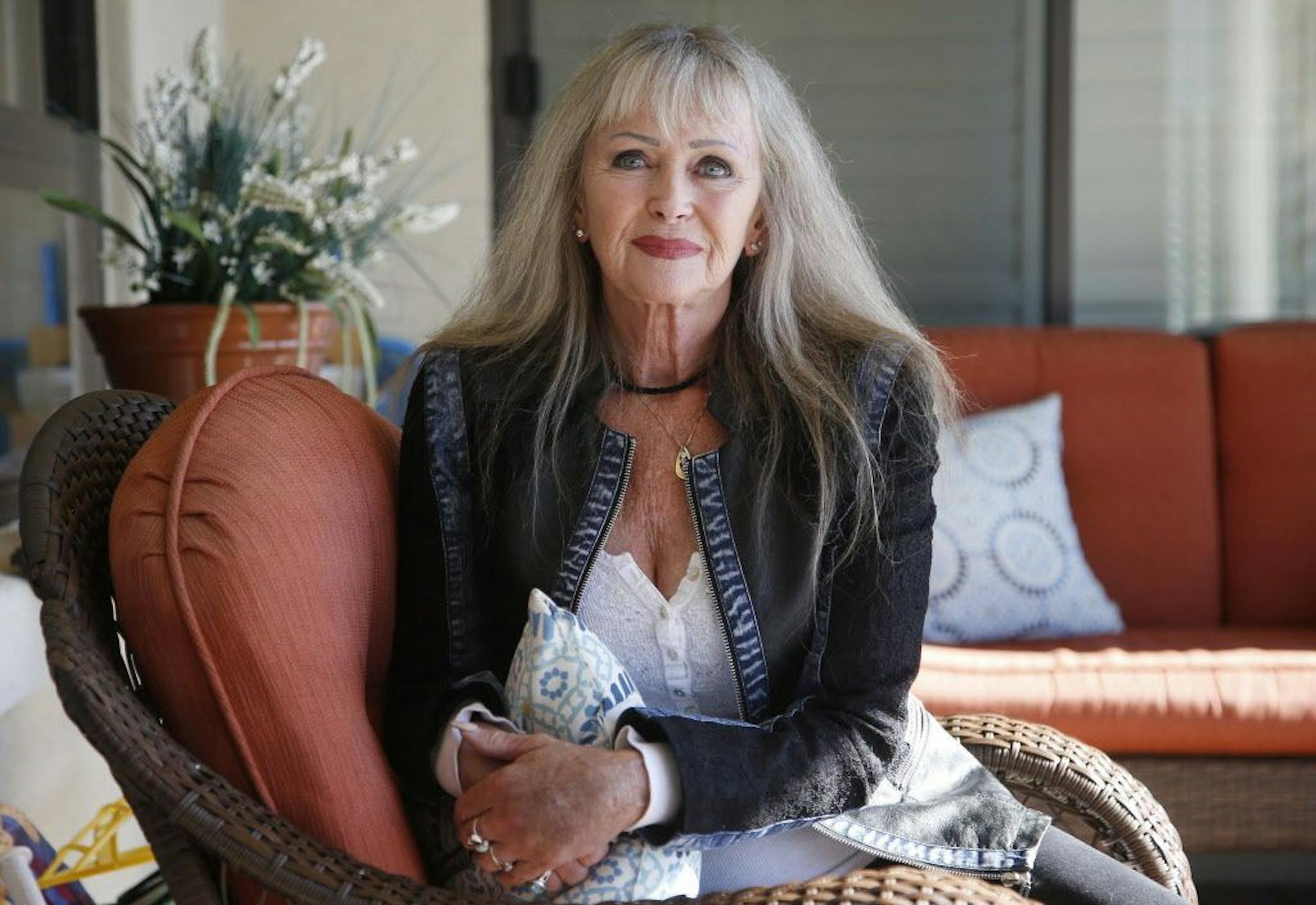 In this Nov. 19, 2018, photo, Felice Soldwedel, wife of Joseph Soldwedel, poses for a photograph at her home in Prescott, Ariz. Joseph Soldwedel, the owner of a chain of small Arizona newspapers, and his wife Felice are locked in a bizarre divorce dispute that includes allegations of poisoning.