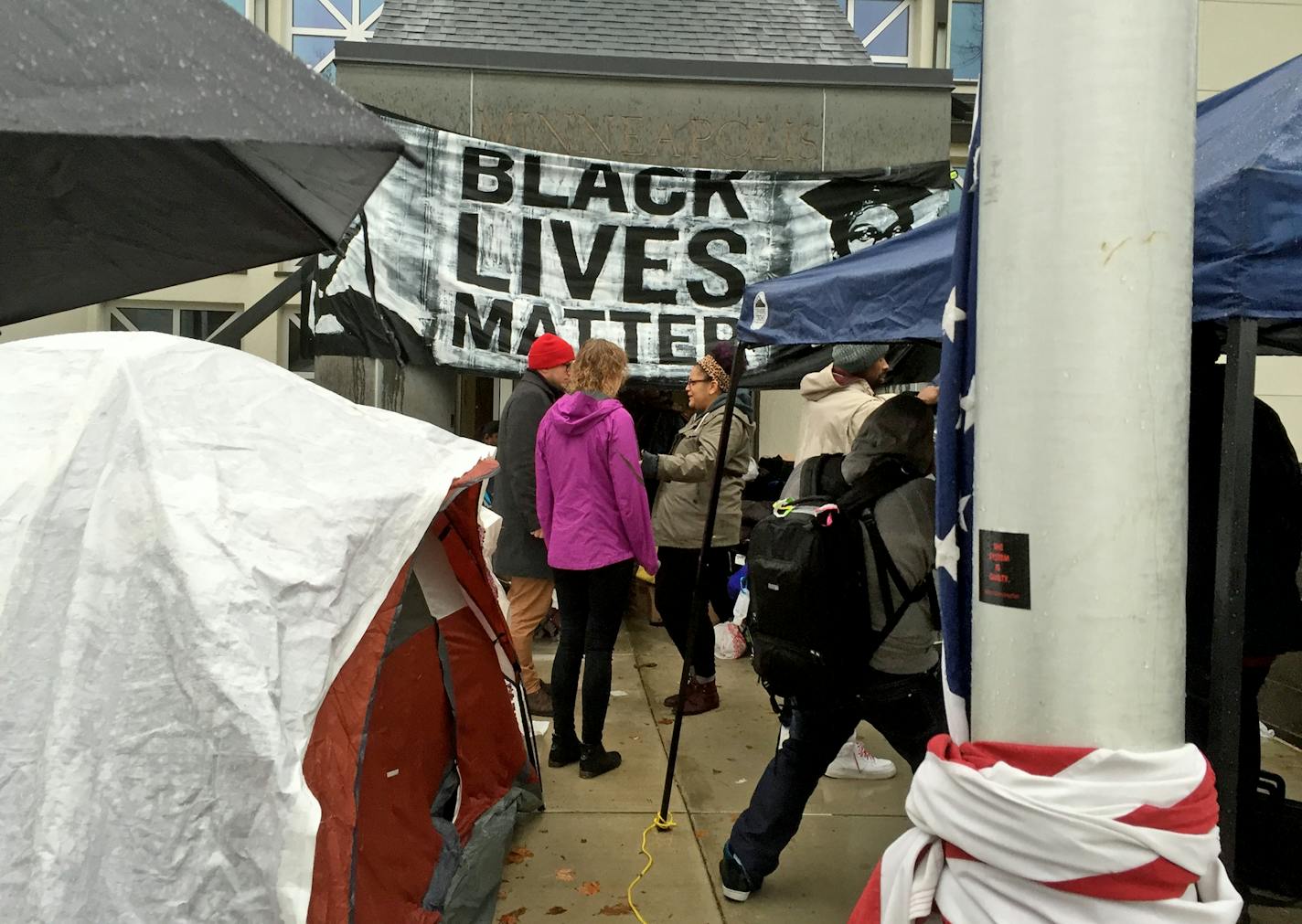 Monday, Black Lives Matter activists keep up their presence Monday at the Police Department's precinct headquarters in north Minneapolis in the wake of police shooting and critically wounding a man over the weekend.