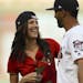 Minnesota Twins left fielder Eddie Rosario surprised The Bachelorette, Becca Kufrin, with a rose after he caught her ceremonial first pitch before the
