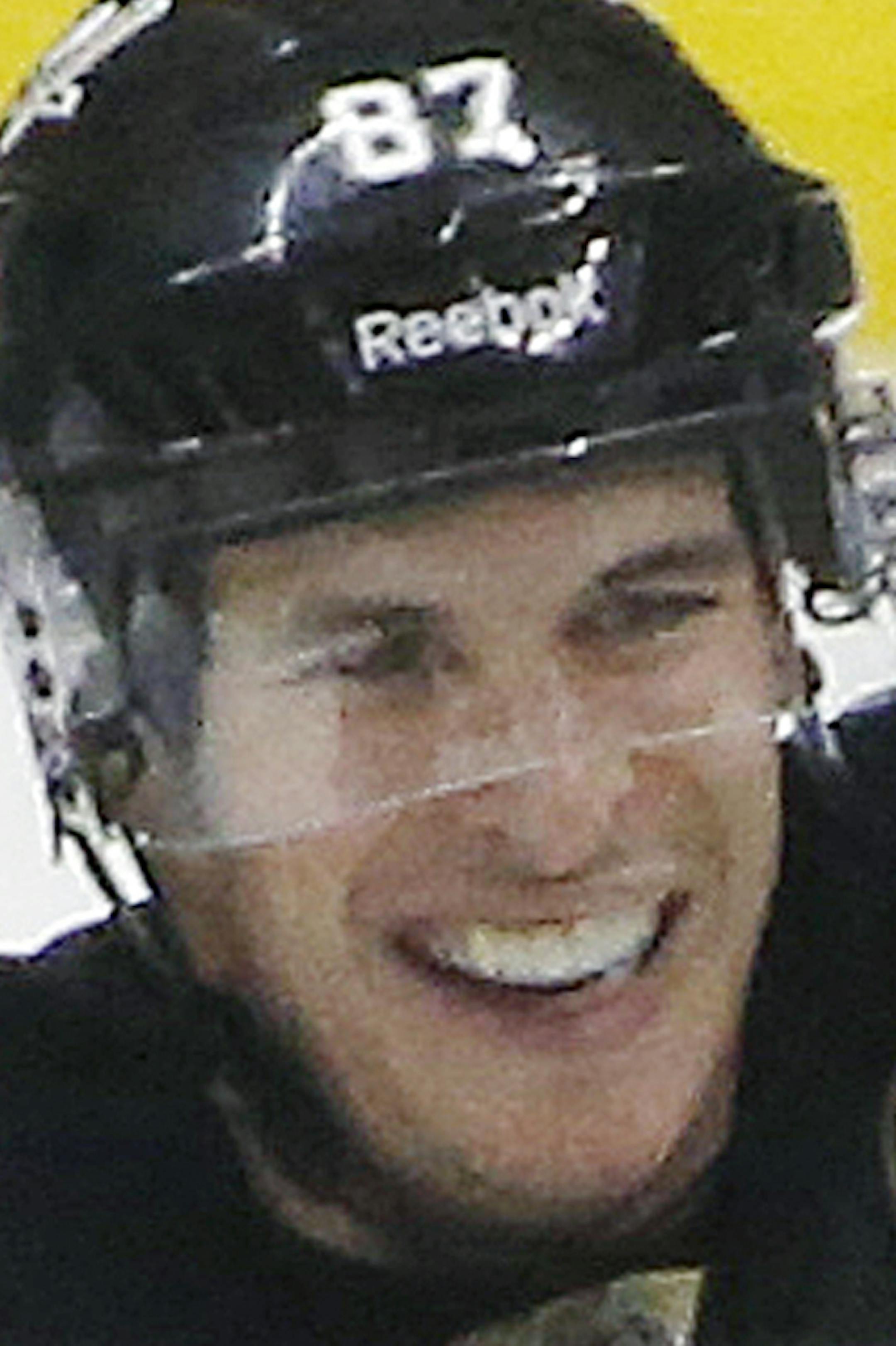 Pittsburgh Penguins' Christian Ehrhoff (10) celebrates his goal with Sidney Crosby (87), and Olli Maatta (3) in the third period of an NHL hockey game against the Ottawa Senators in Pittsburgh Saturday, Dec. 6, 2014. The Penguins won 3-2. (AP Photo/Gene J. Puskar)