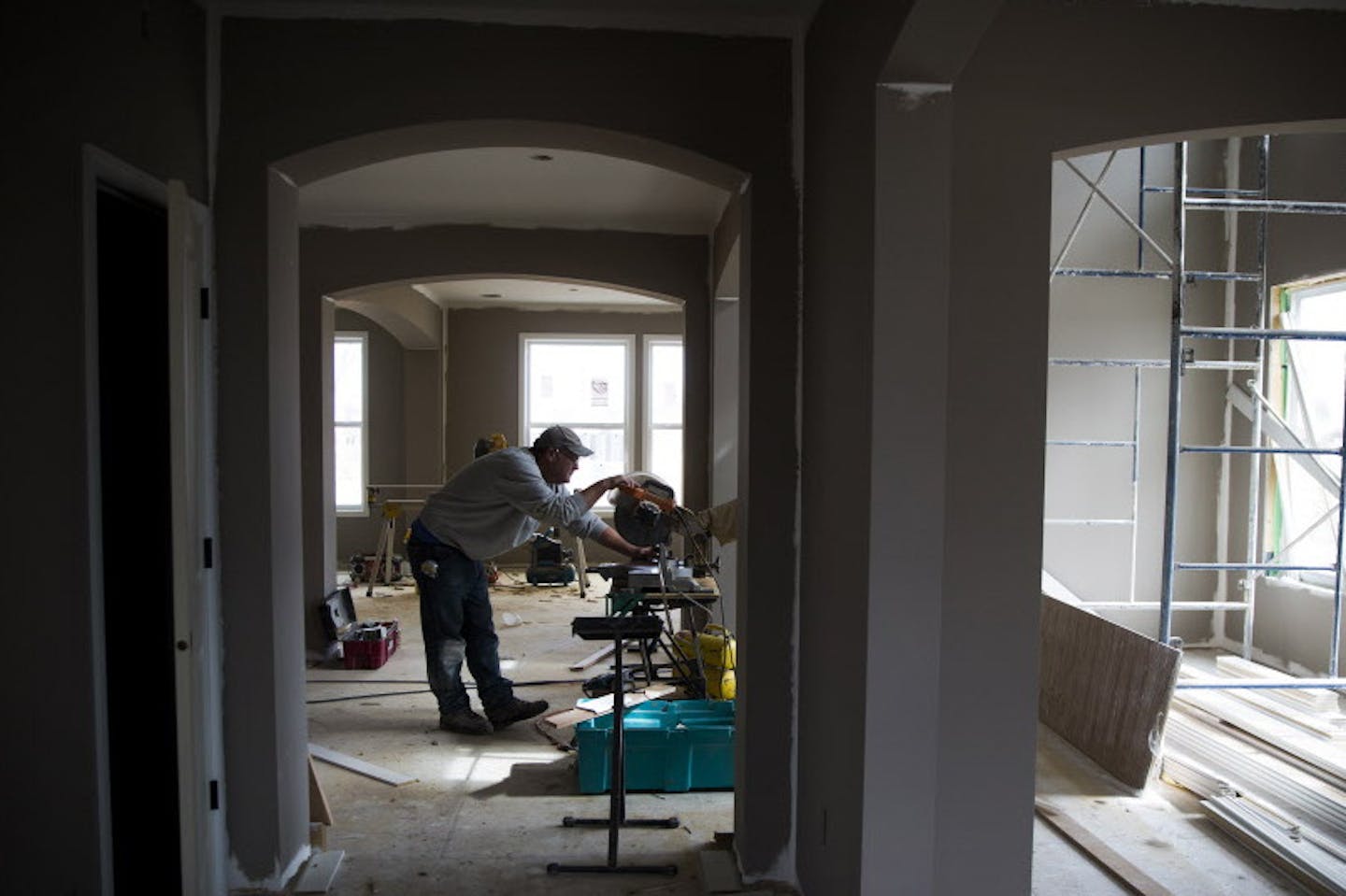 Trim carpenter Mike Horsch works to build a home in the new Lennar Homes development called The Reserve at Spring Meadows in Plymouth on Thursday, March 26, 2015. ] LEILA NAVIDI leila.navidi@startribune.com /