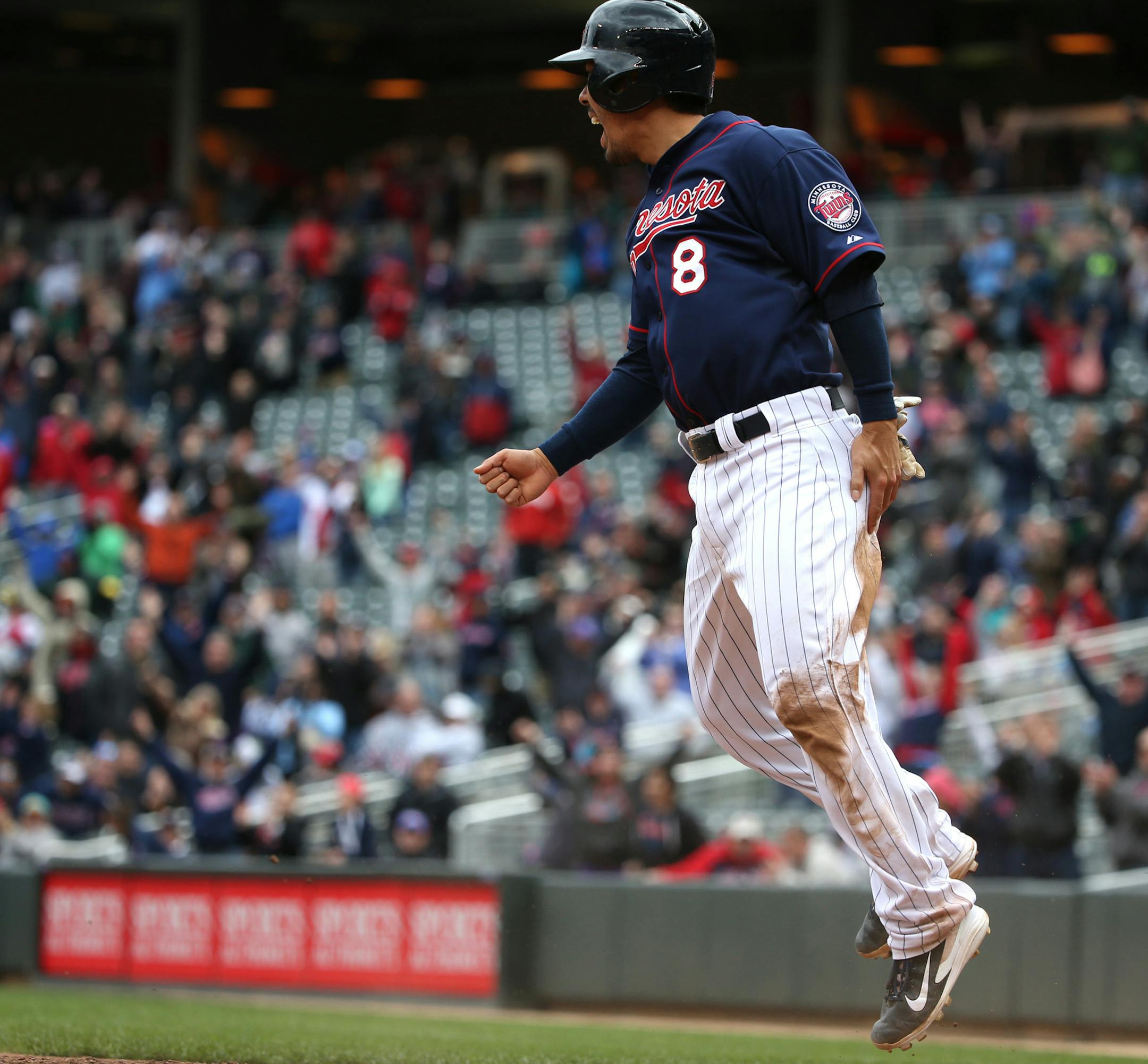 Twins Kurt Suzuki celebrated after across home plate as the winning run in the 10th inning.. ] (KYNDELL HARKNESS/STAR TRIBUNE) kyndell.harkness@startribune.com Twins won over the Boston Red Sox 4-3 in the 10th inning at Target Field in Minneapolis, Min. Thursday, May 15, 2014.