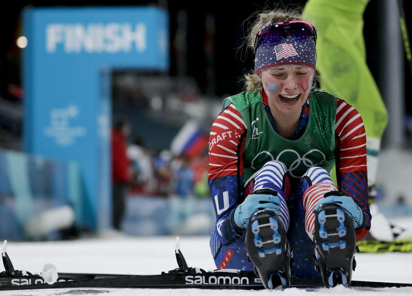 Jessica Diggins celebrates after winning the gold medal in the during women's team sprint freestyle cross-country skiing final at the 2018 Winter Olympics.