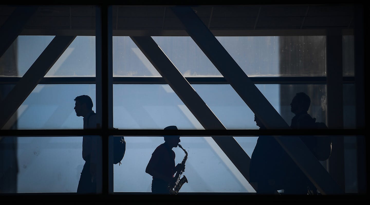 Richard Fairbanks, of Minneapolis, played the saxophone for passersby in the skyway over Fourth Avenue connected to the Hennepin County Government Center Friday afternoon. Fairbanks says he plays in that specific skyway every Friday during the colder months of the year and spends the rest of the time playing on the Stone Arch Bridge. "I like this spot because I like to play for couples who get married by a justice of the peace (at the government center)," said Fairbanks. "It's very touching to m