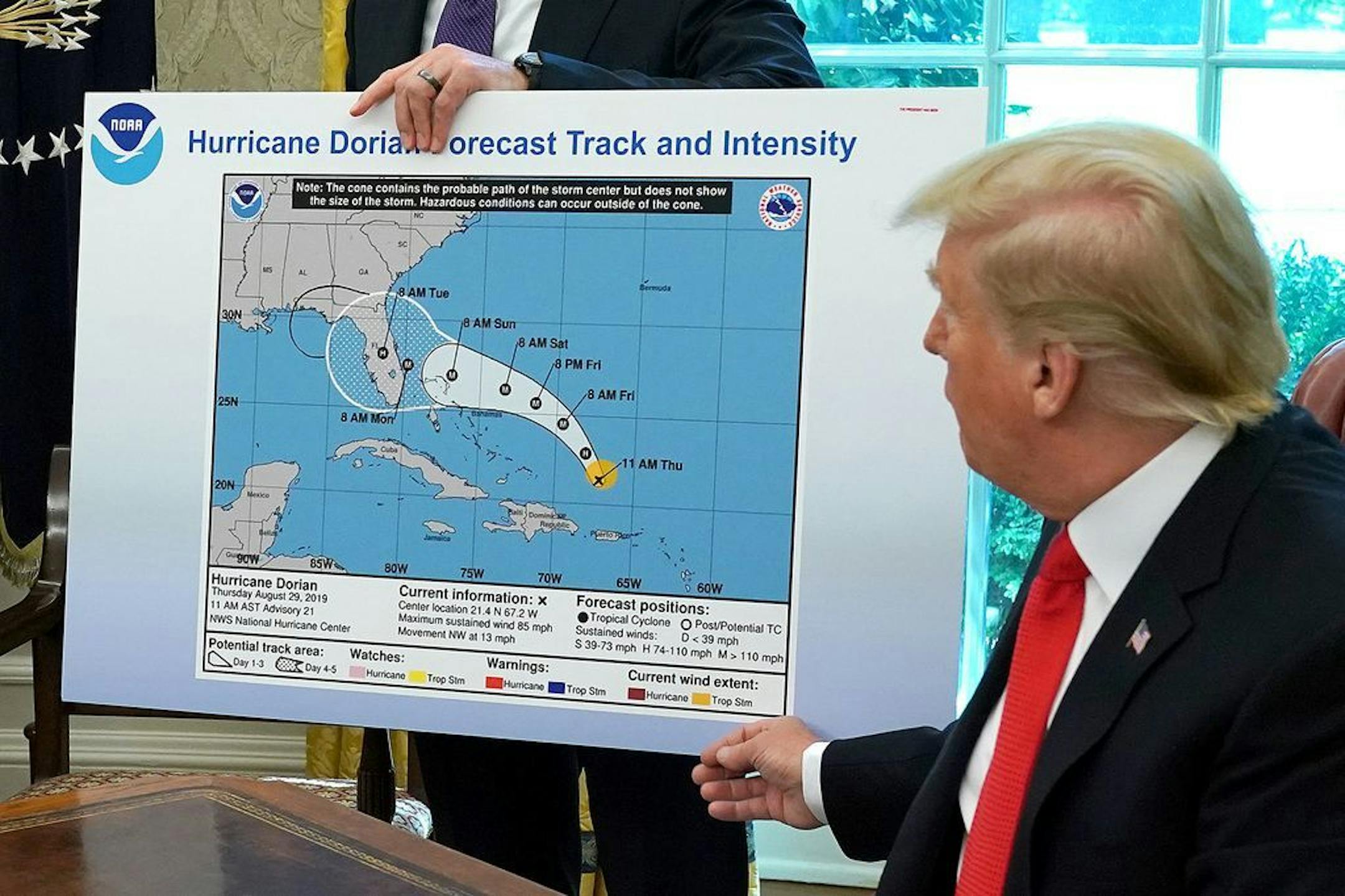 President Donald Trump references a map while talking to reporters in the Oval Office Wednesday, Sept. 4, 2019. The map was a forecast from August 29 and appears to have been altered by a black marker to extend the hurricane's range to include Alabama.