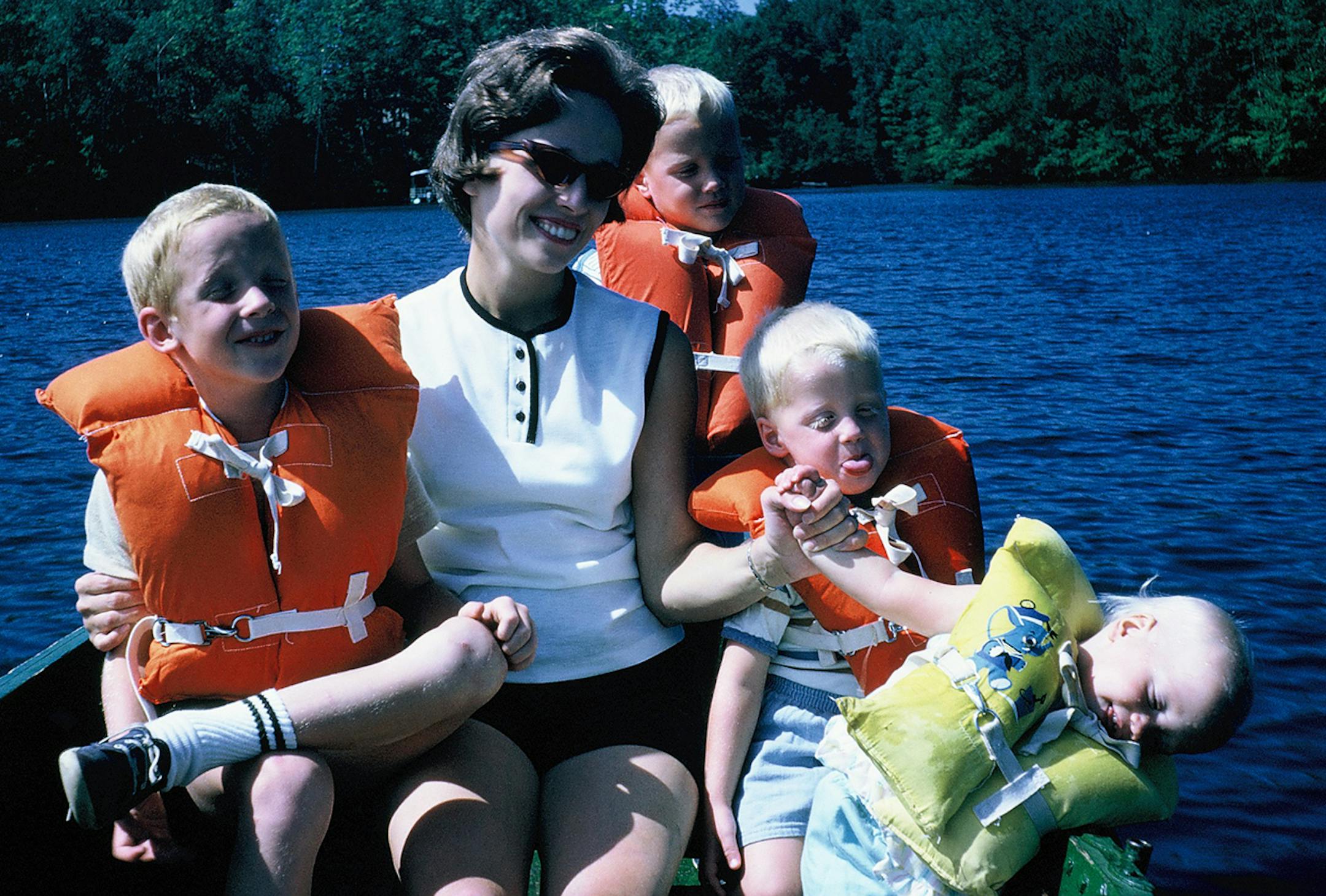 This is Mom and the kids in the green boat at the lake in northern Wisconsin circa summer 1966. From left to right, David, Cynthia, Steven, Mark, and Susan Holmberg. (I always thought my mom was so glamorous in sunglasses. And looking back at pictures, I can see why. She sported some pretty fabulous pairs in a lot of the vacation pictures. These, like all the others no doubt, were probably straight off the rack of our suburban Chicago Walgreen's.) Mark Holmberg 20 Thomas Avenue South Minneapolis