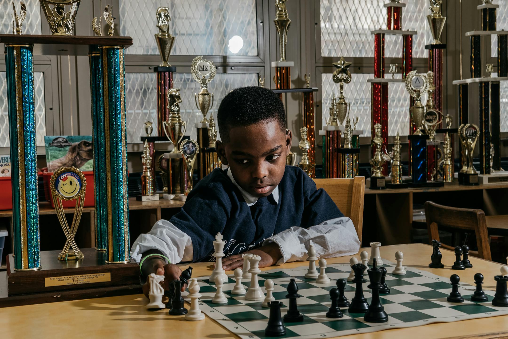 FILE — Tanitoluwa Adewumi, 8, the newly-crowned state chess champion for kindergarten through third grade, at Public School 116 in Manhattan, March 14, 2019. "The larger lesson of Tani's story is simple: Talent is universal, while opportunity is not," writes New York Times opinion columnist Nicholas Kristof. (Christopher Lee/The New York Times)