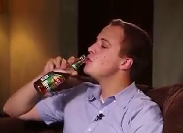In this screengrab from YouTube, legislative candidate Max Rymer finishes his argument on behalf of legalizing Sunday alcohol sales by him chugging a 