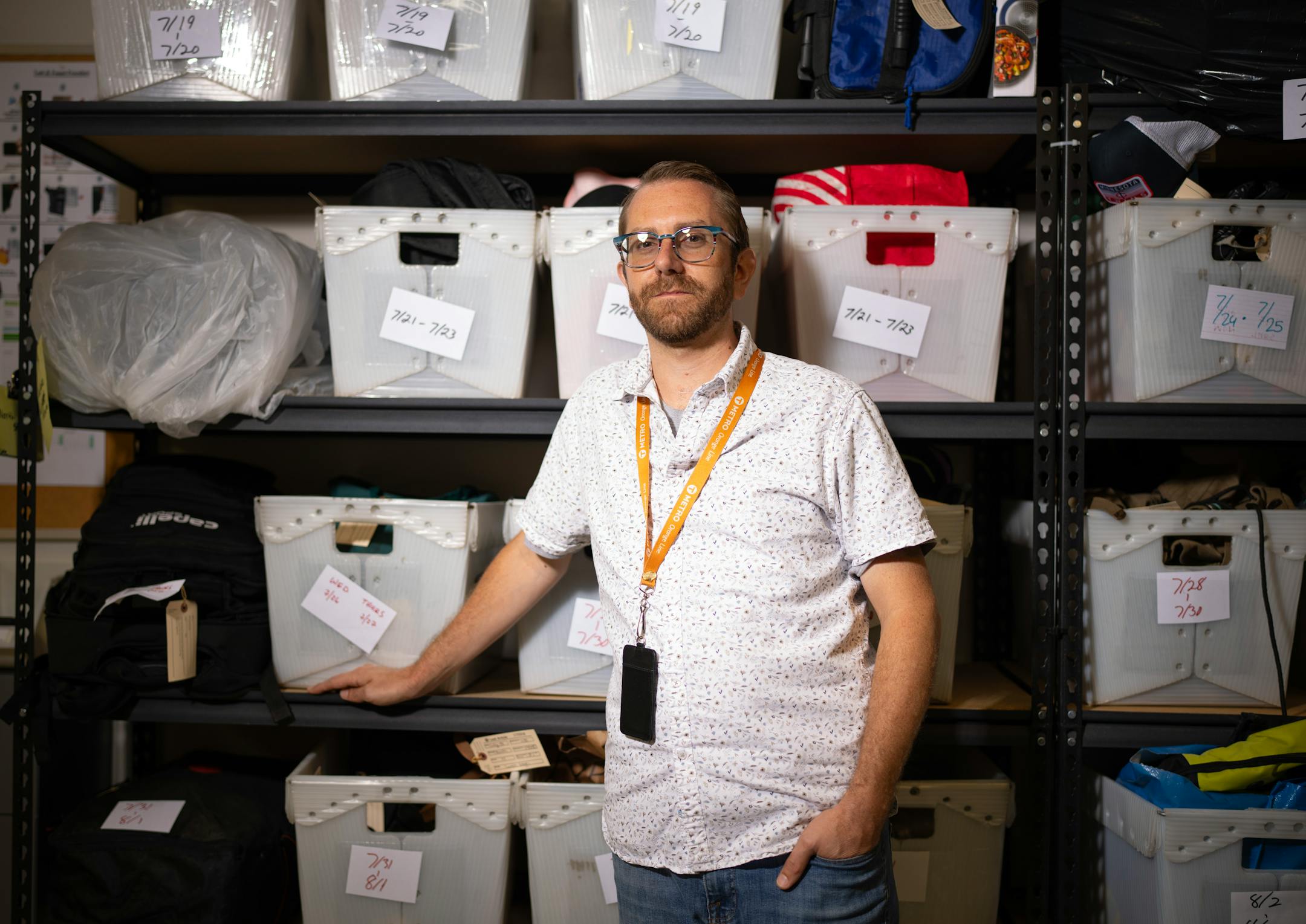 Metro Transit's Lost and Found manager Jeremy Hop in the storage room full of objects left on busses and trains Monday, August 7, 2023, at Metro Transit headquarters in Minneapolis. The Customer Service staff at Metro Transit headquarters in Minneapolis are the custodians of items left behind on buses and trains.