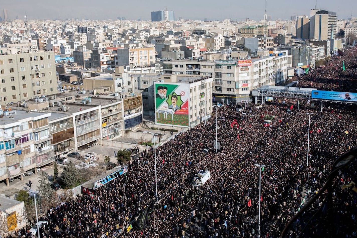 The coffins of Maj. Gen. Qassem Soleimani and others are carried on a truck through Tehran during a funeral procession on Monday, Jan. 6, 2019. Suleimani and the others were killed by the United States on Friday in Baghdad in a drone strike.