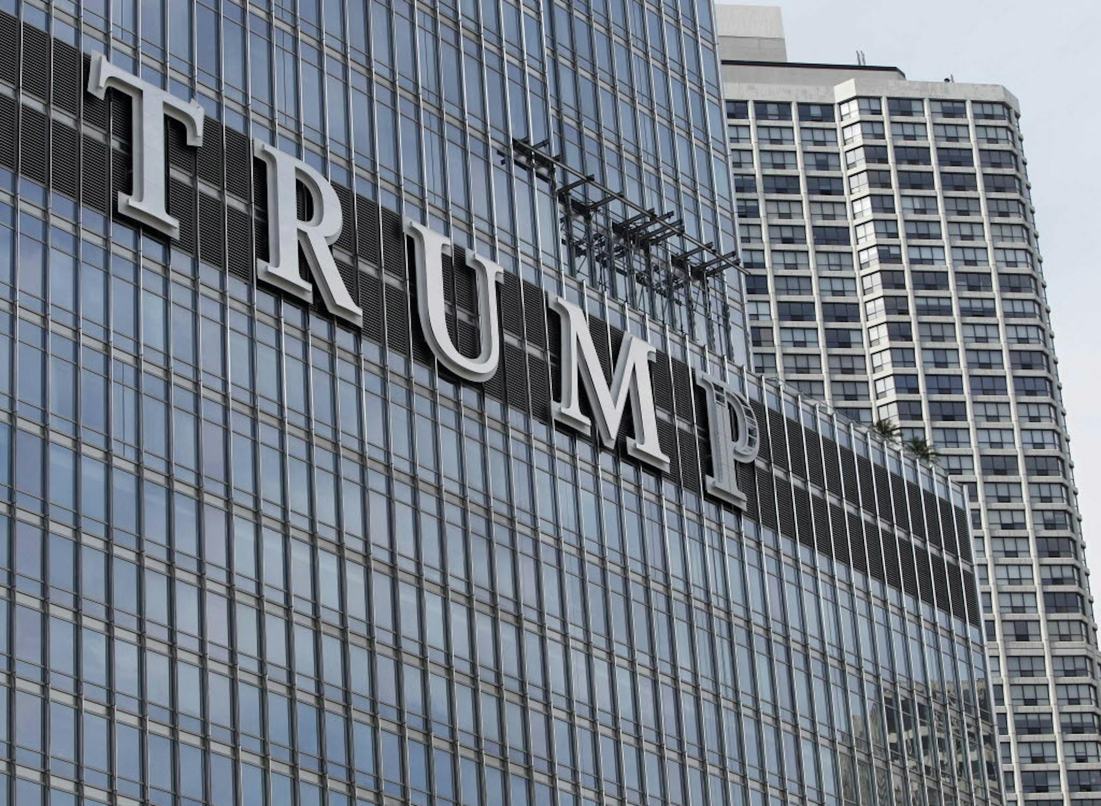 June 12, 2014: Newly-installed 20-foot-tall letters spelling out T-R-U-M-P stand on the side real estate billionaire Donald trump's skyscraper in Chicago.